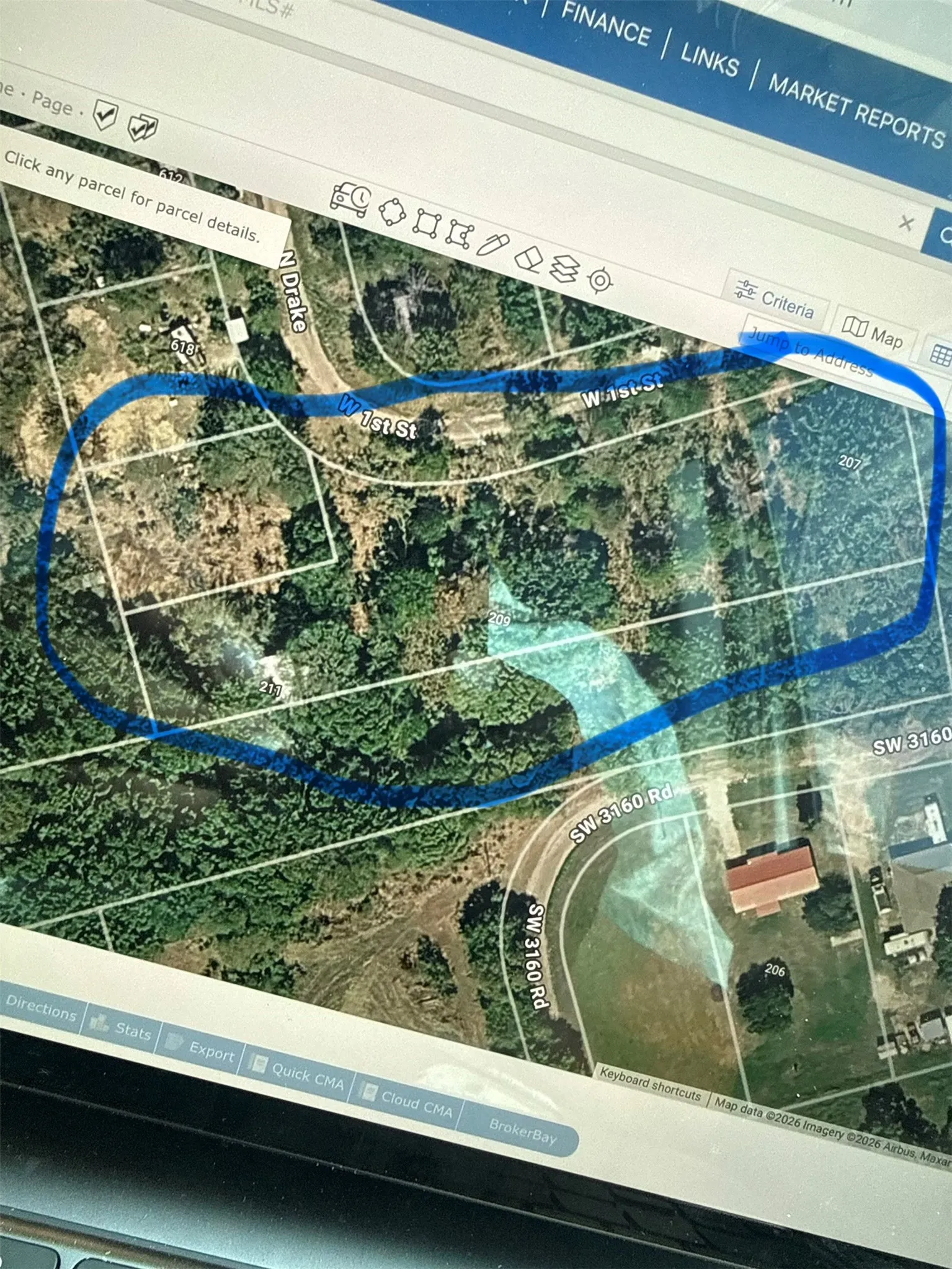 Real Estate Mapping Software. Aerial view of the property and its surrounding parcels