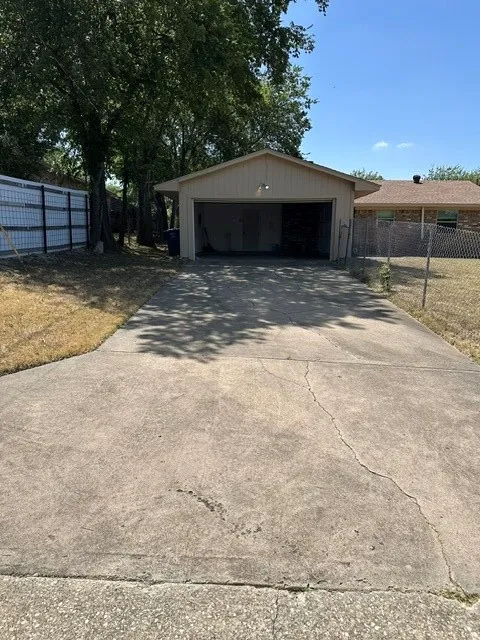Attached two-car garage with real entry driveway