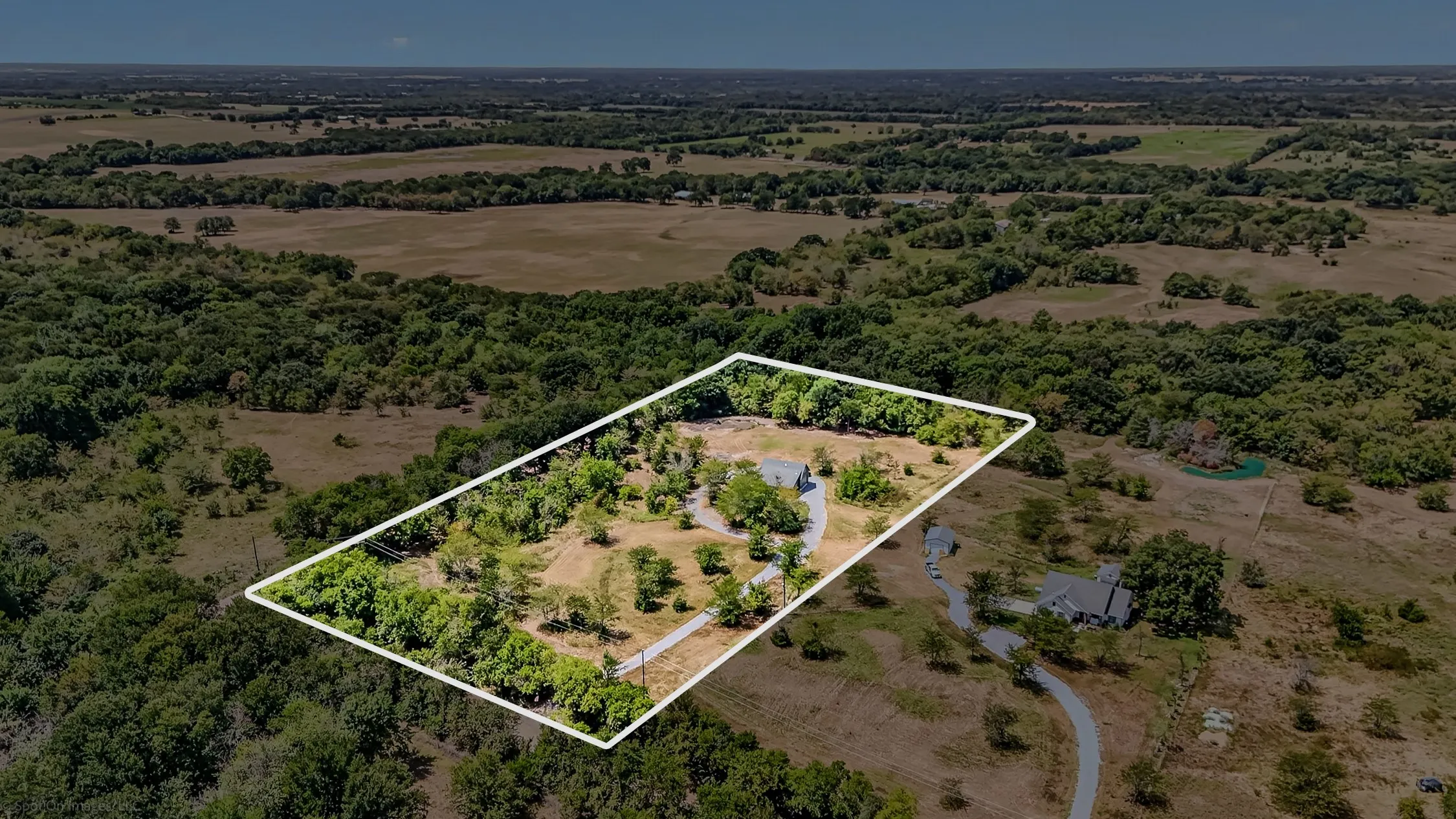 Aerial of the home on acreage