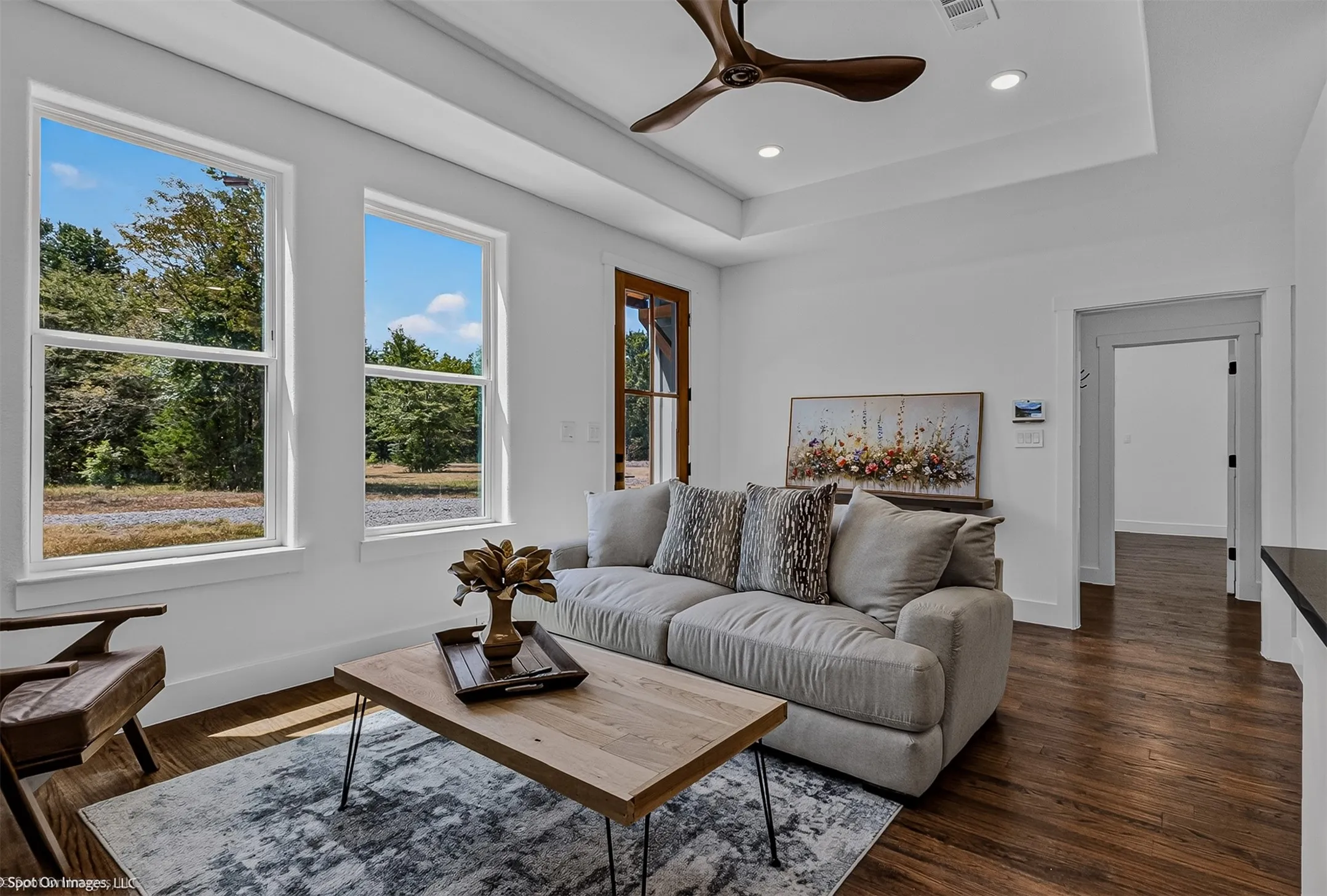 Open and airy living space with hardwood flooring throughout