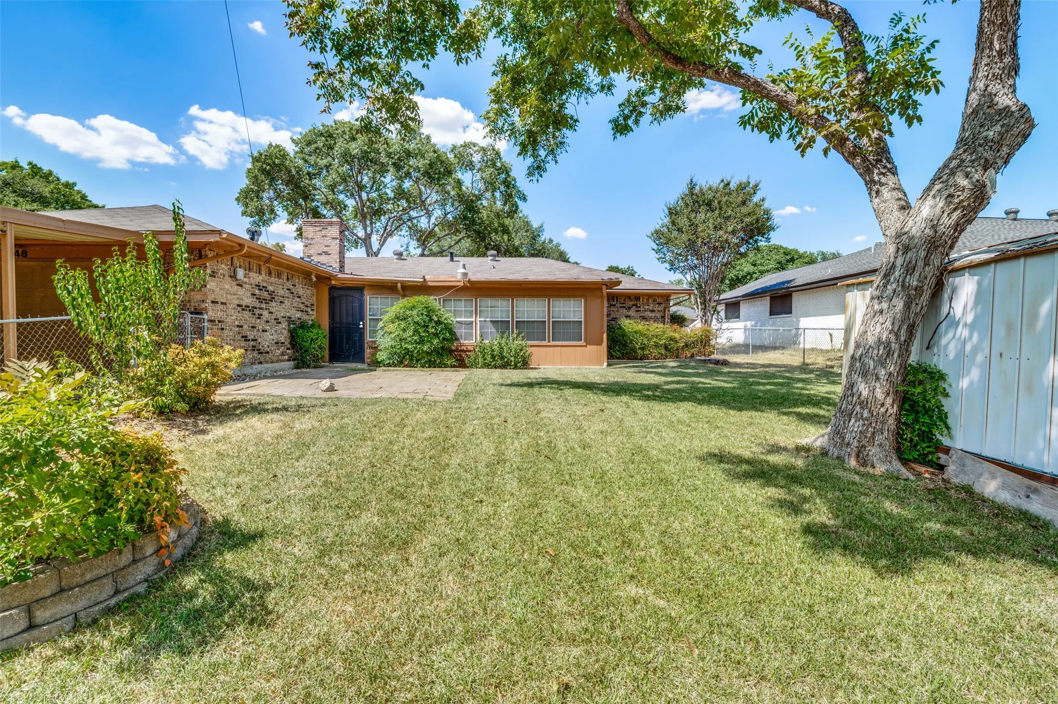grassy backyard is well kept