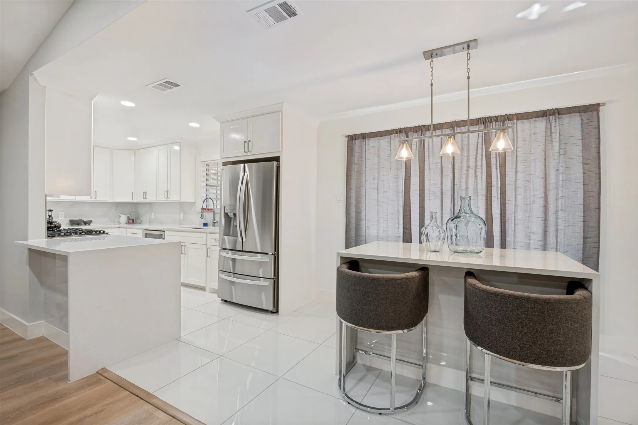 new quartz countertops provide space to prep, cook and eat.