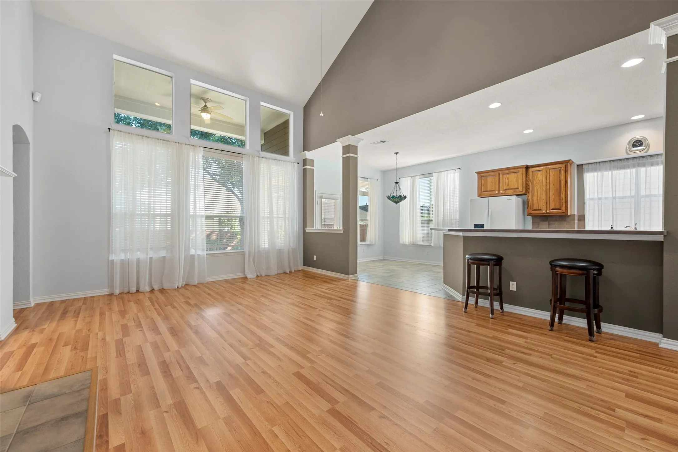From living room to the kitchen, the bar area has room for stools and has lots of light from the windows