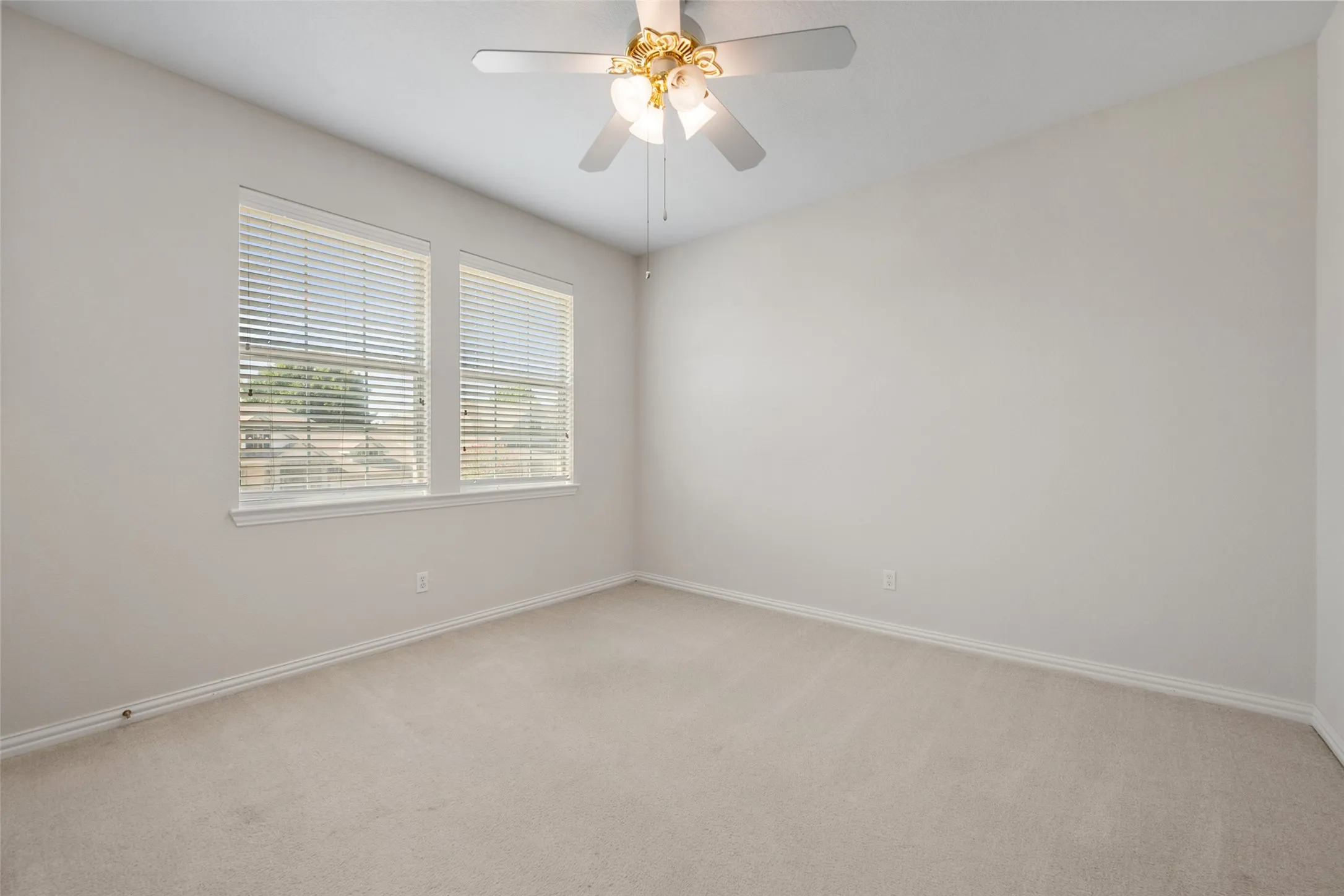 Upstairs Bedroom 2 has walk in closet and fan