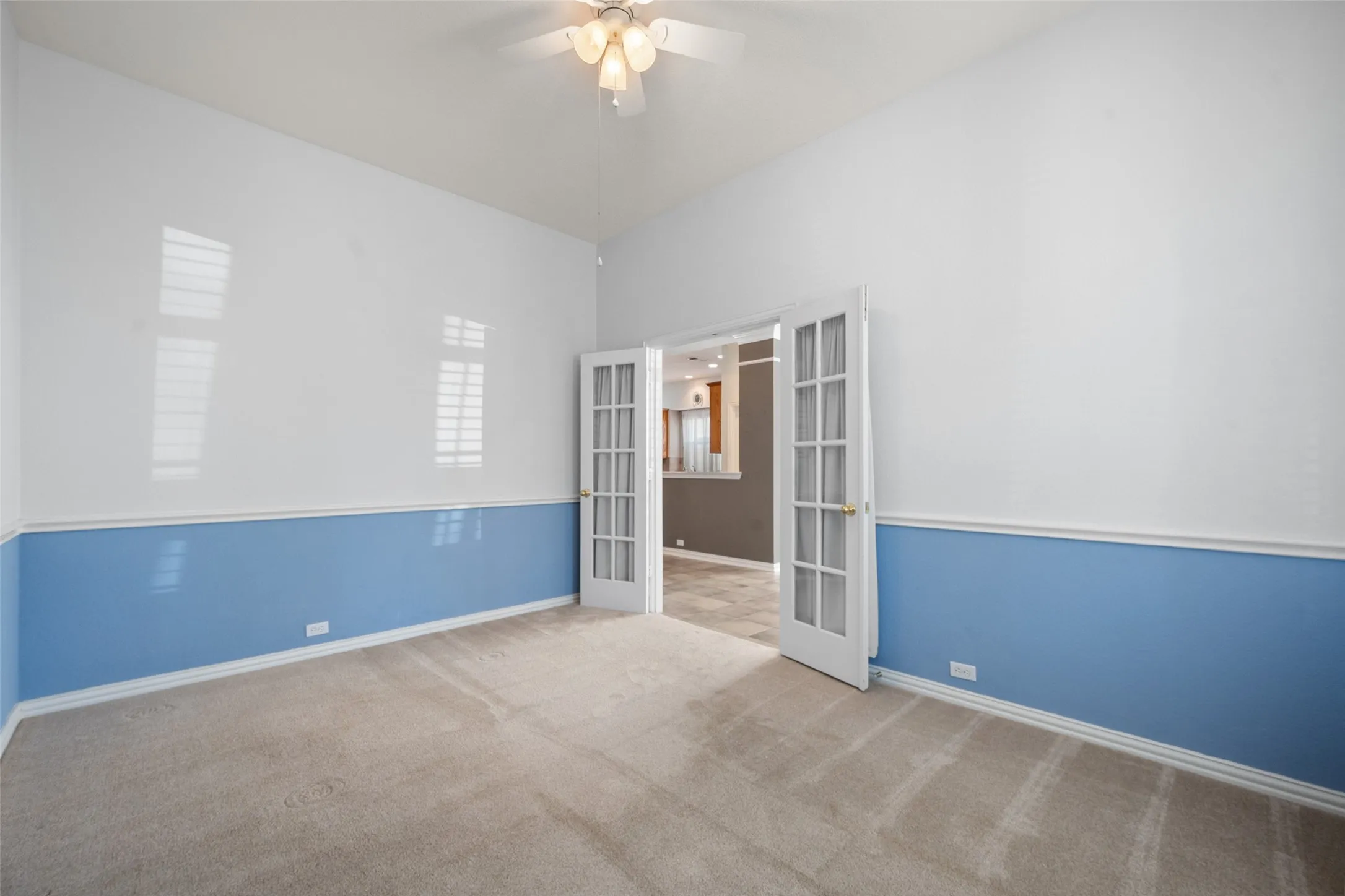 This space has double doors and perfect for a home office, music room or another living space