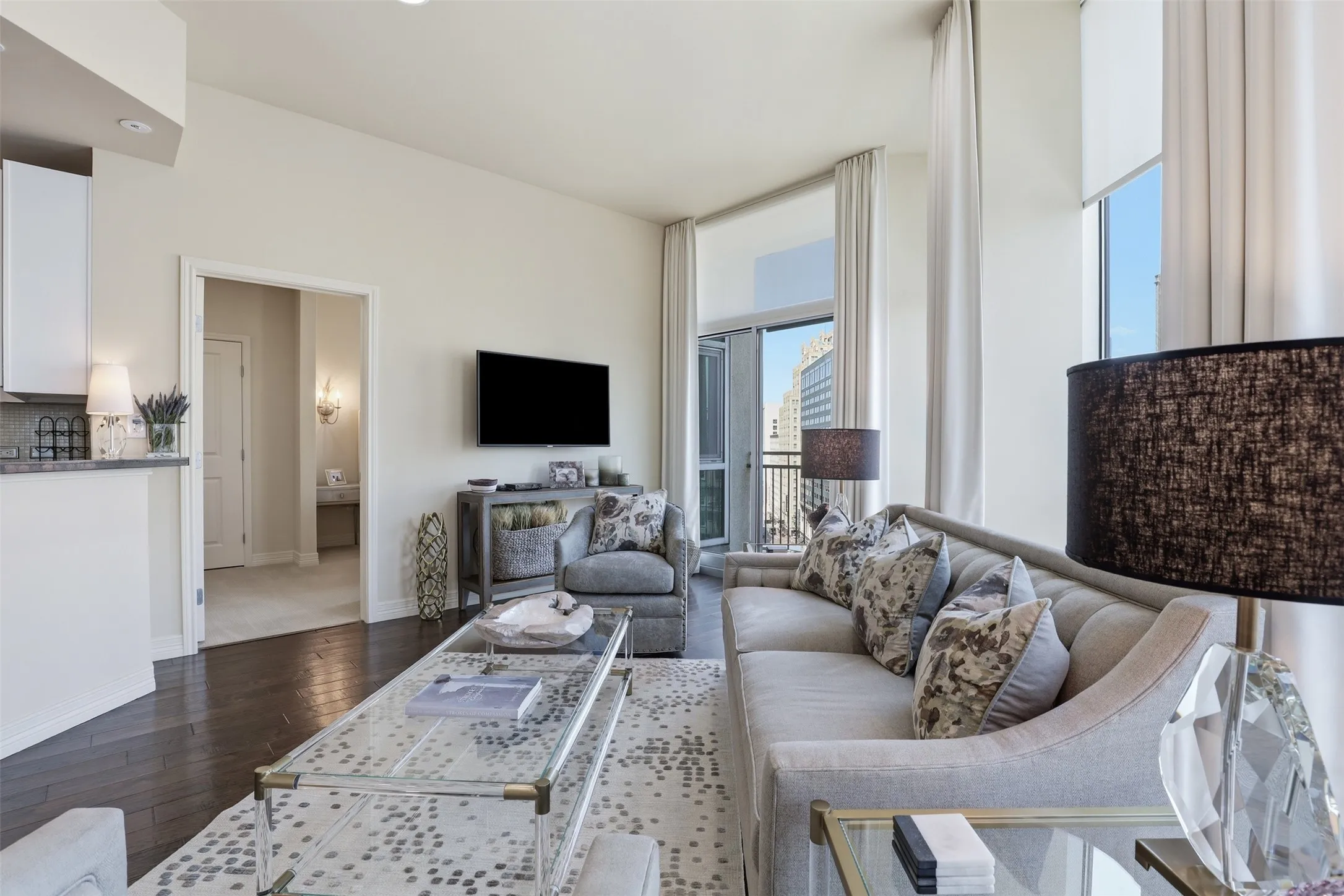 Hardwood flooring, recessed lighting, and balcony access