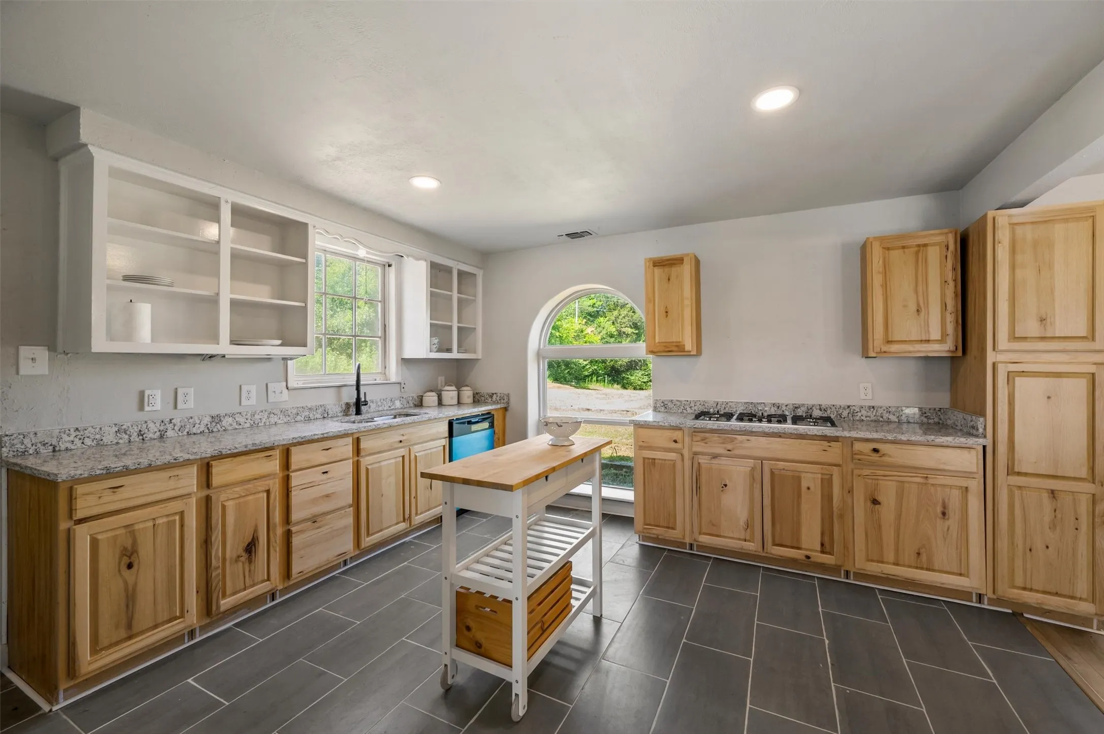Alternate view of kitchen with new dishwasher.