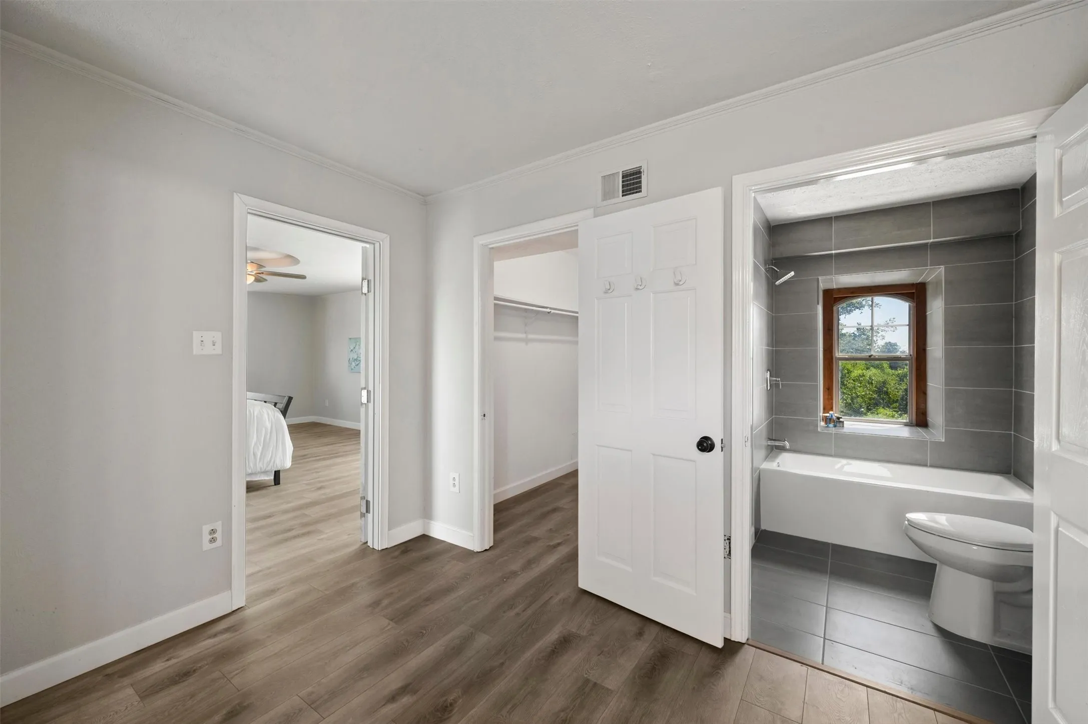 Primary en-suite bathroom and walk-in closet.