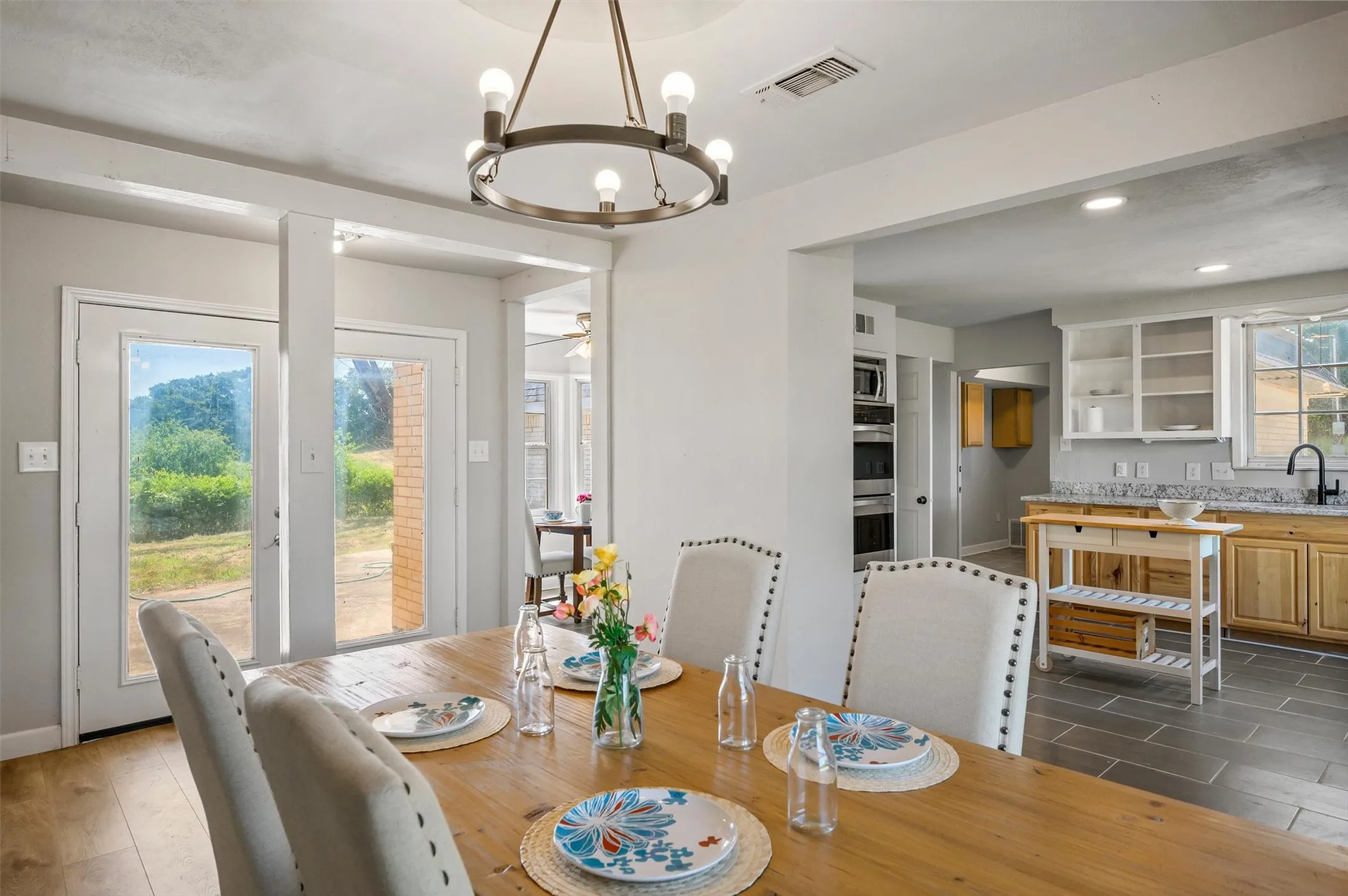 Alternate view of the dining area with French doors to the back patio.