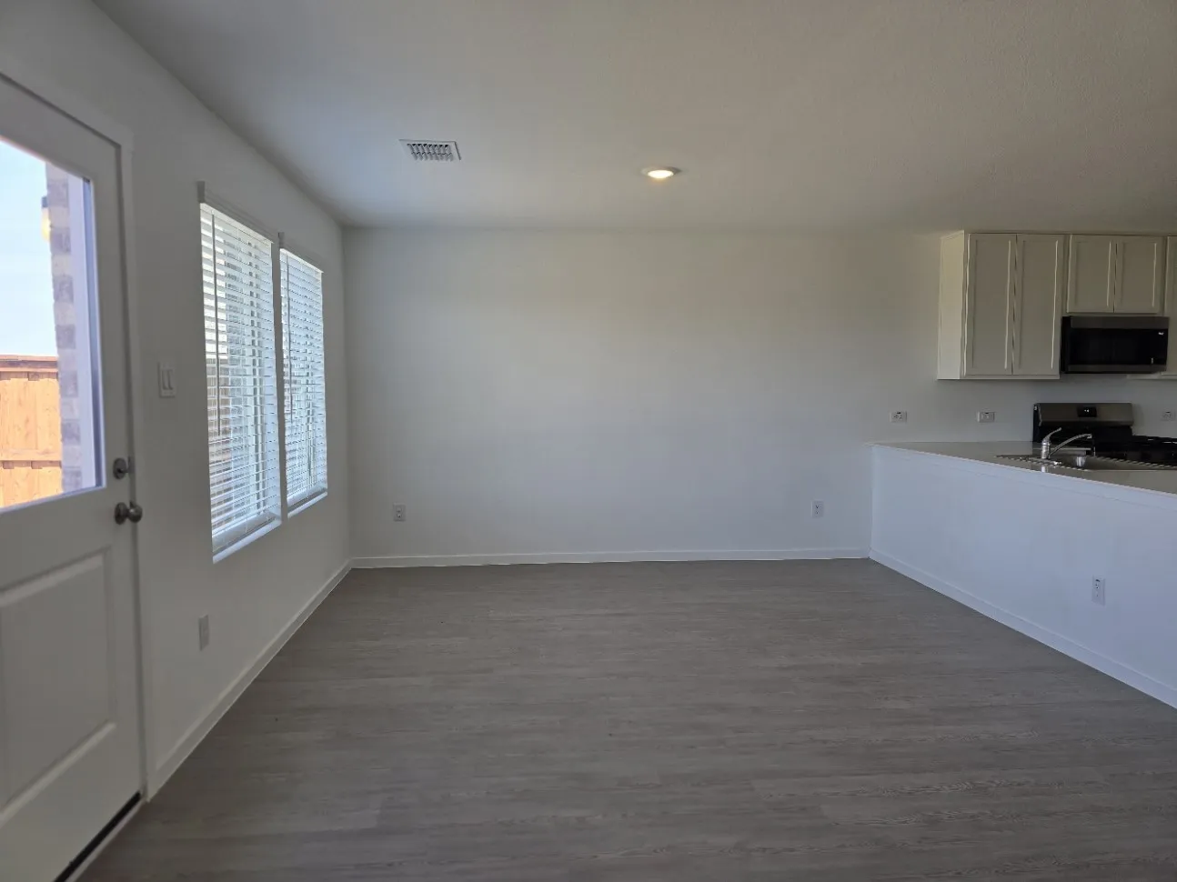 Large open breakfast area with LVP flooring