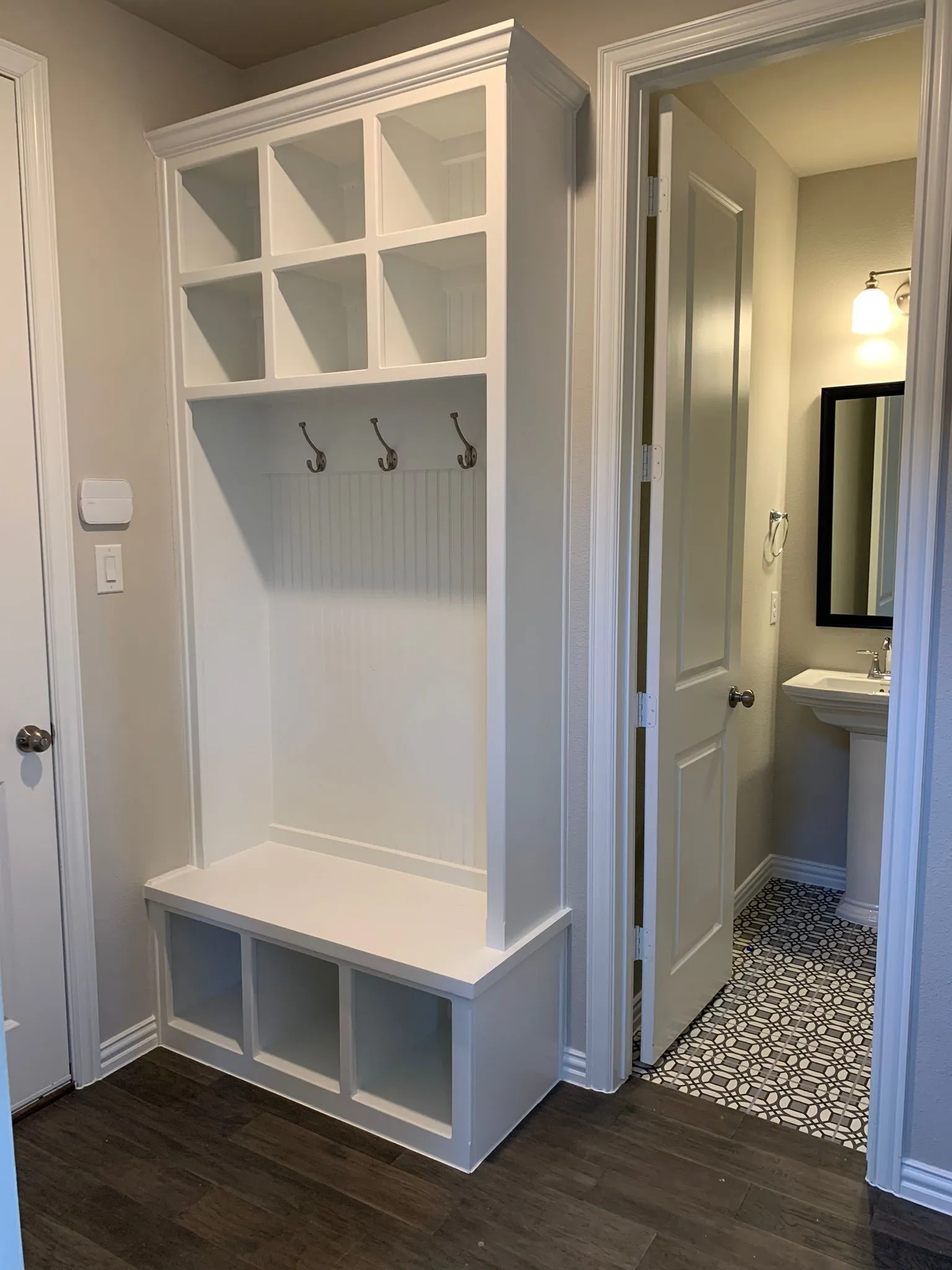 Built-in hall tree with storage cubbies and coat hooks
