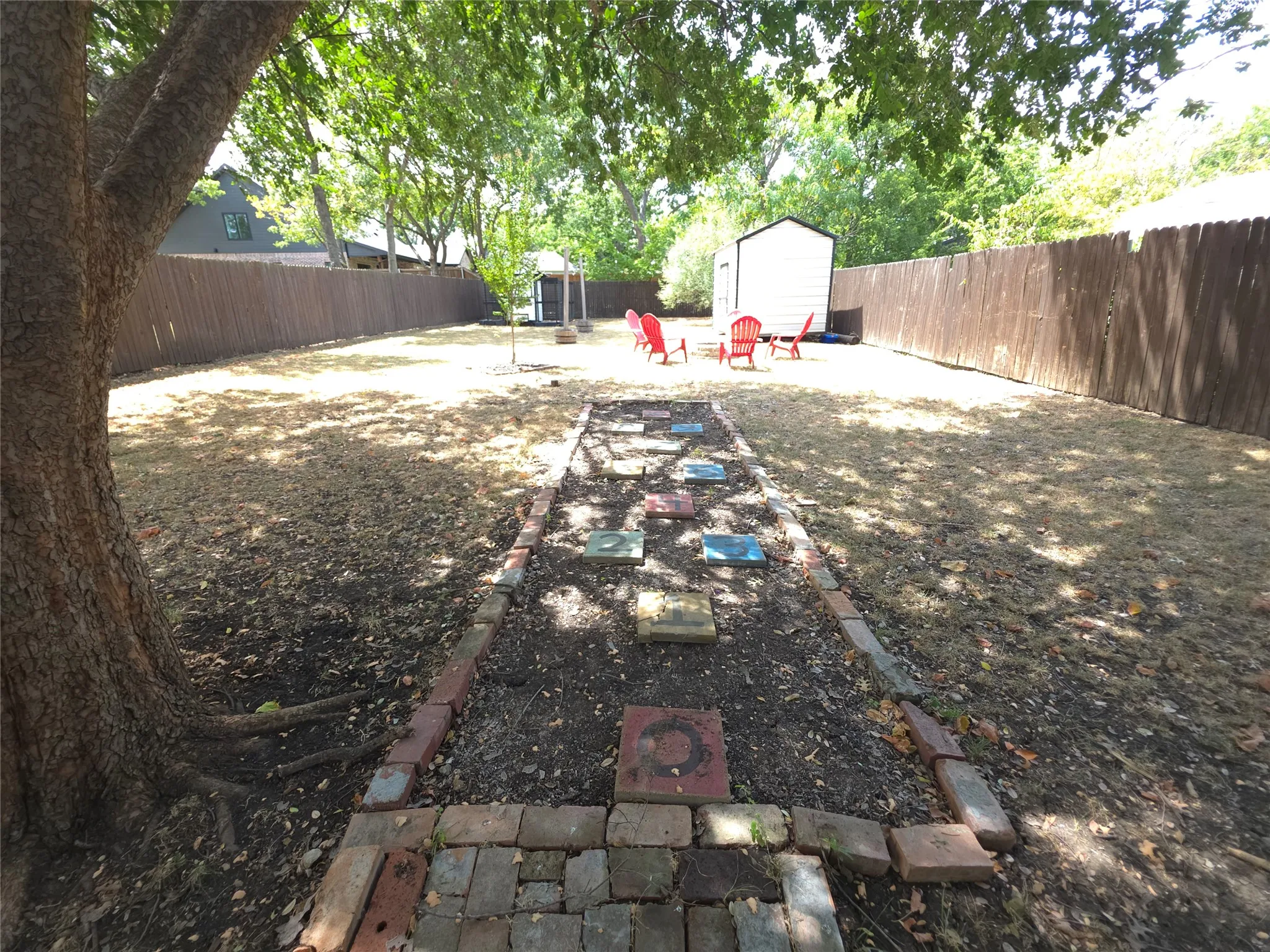 Spacious backyard with a fun hopscotch