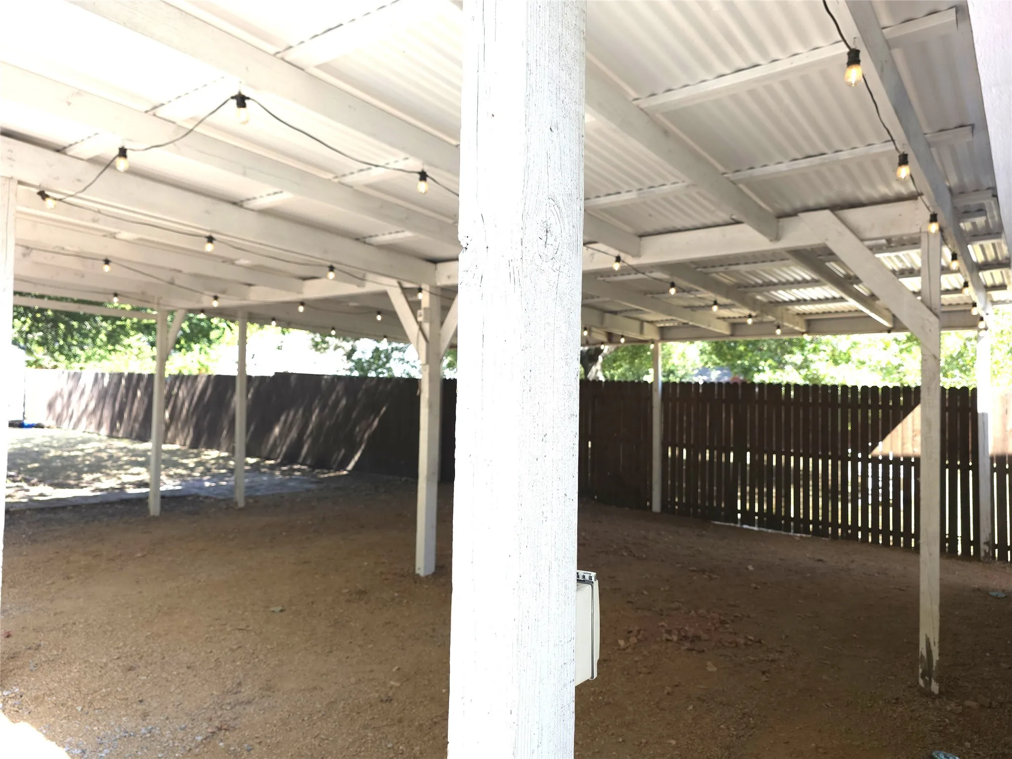 The oversized carport doubles as a great patio for entertaining