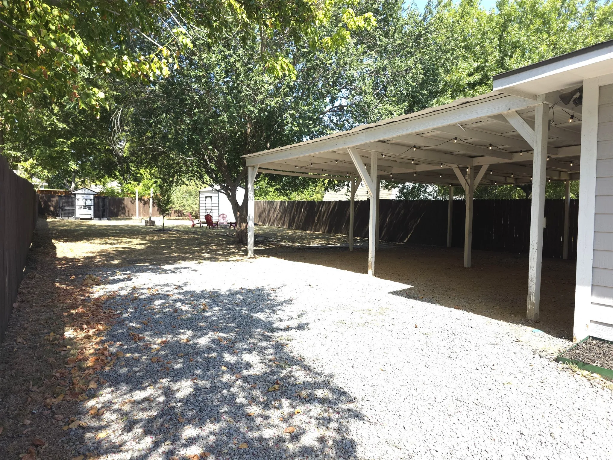 Side driveway into oversized carport