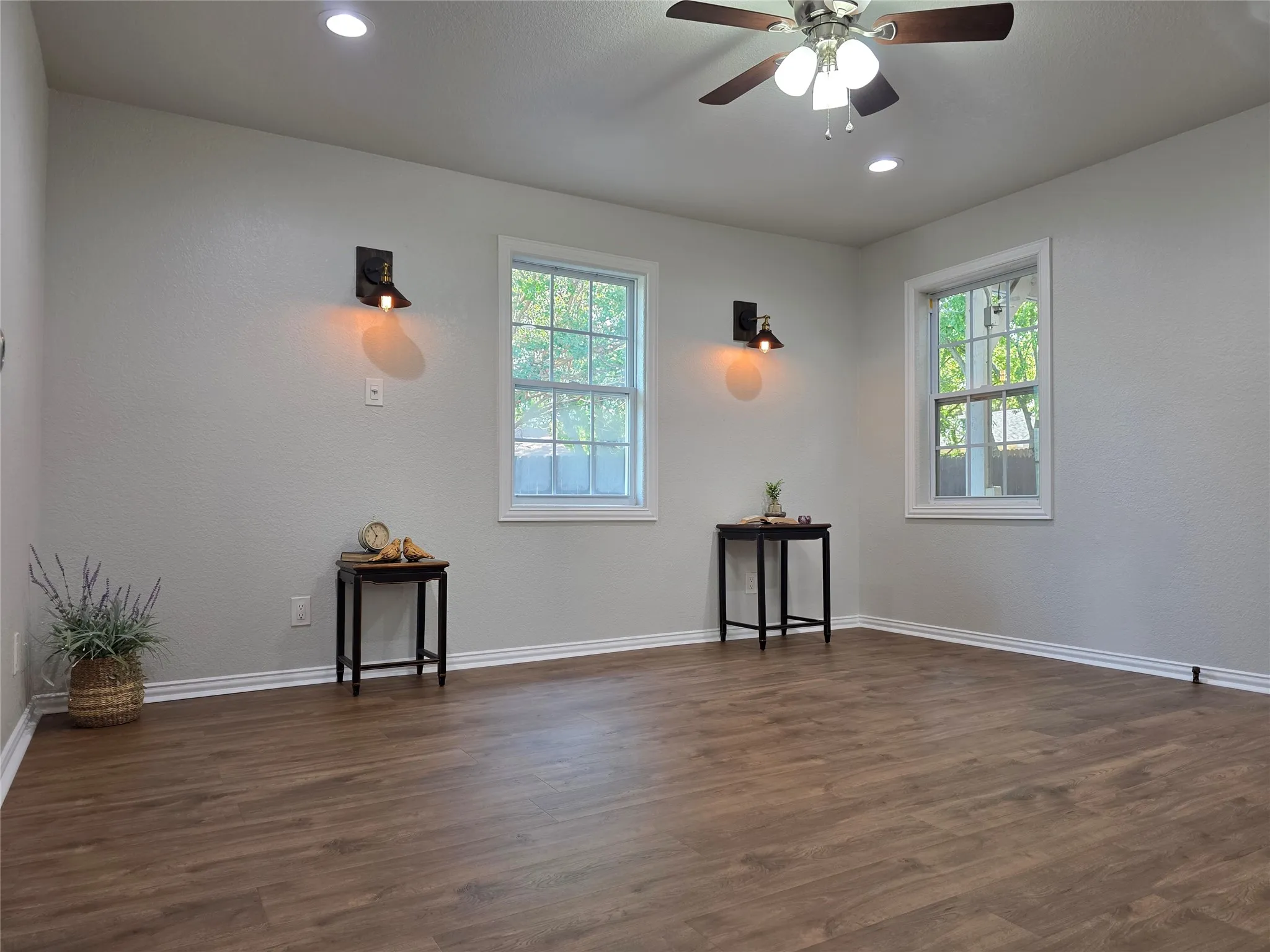 Beautiful Pergo flooring and stylish built-in wall sconces.