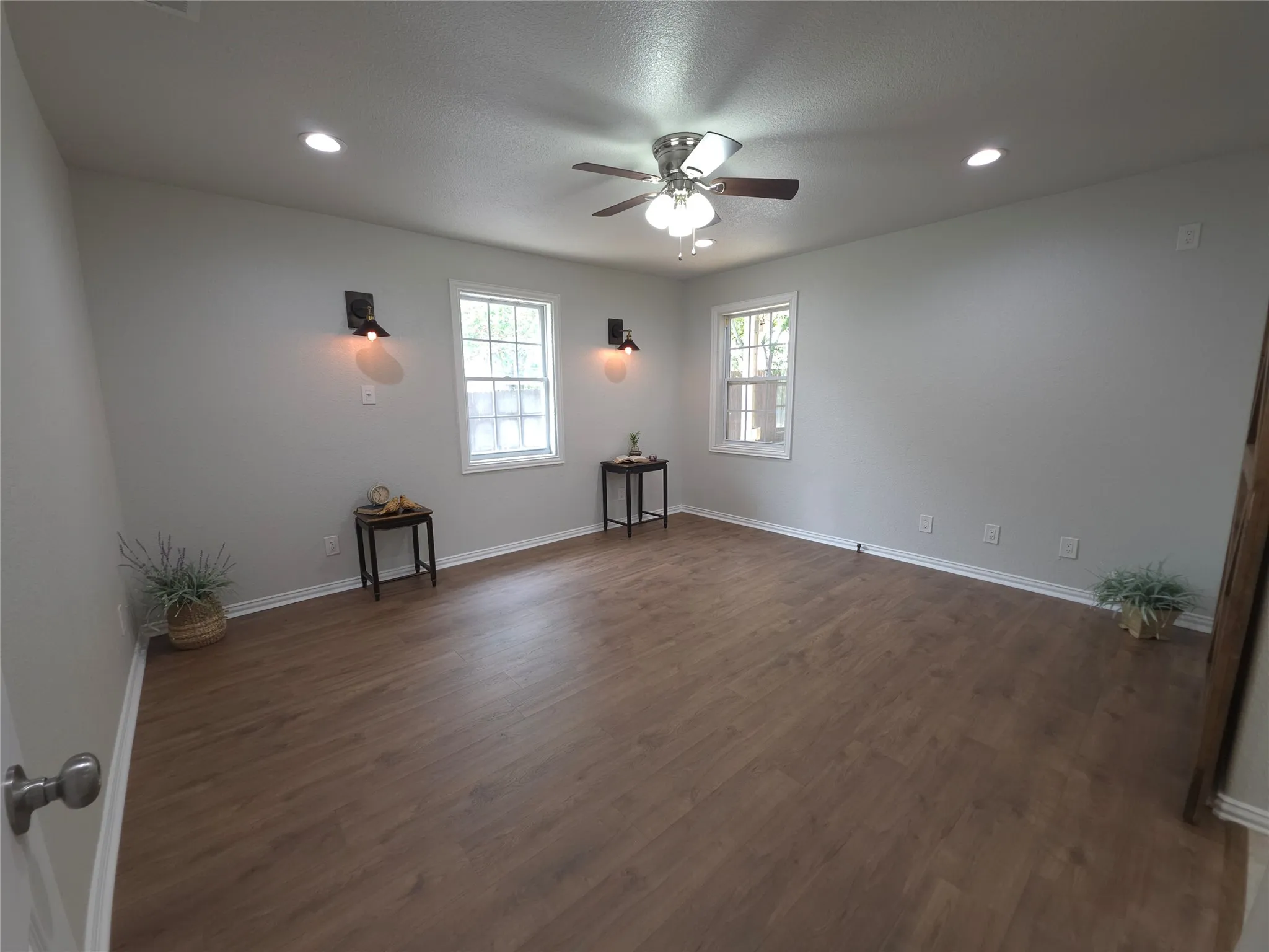 Wide view of primary bedroom