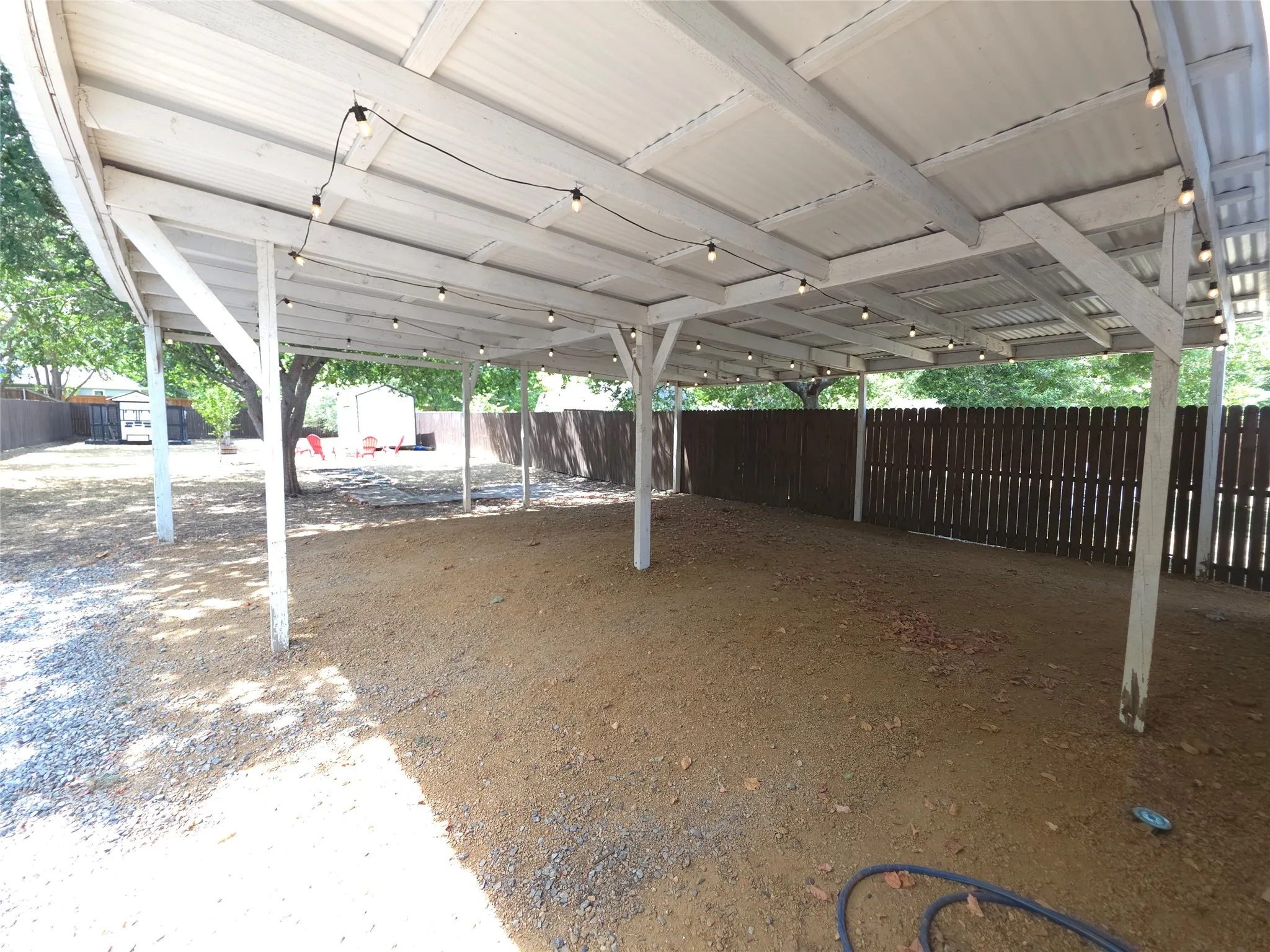Carport with string lights ready to entertain