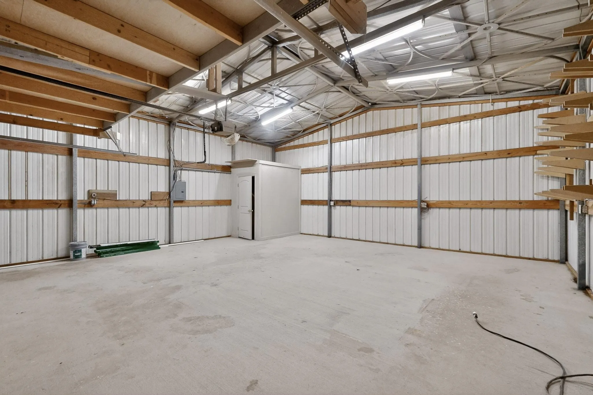 Garage with metal wall and electric panel