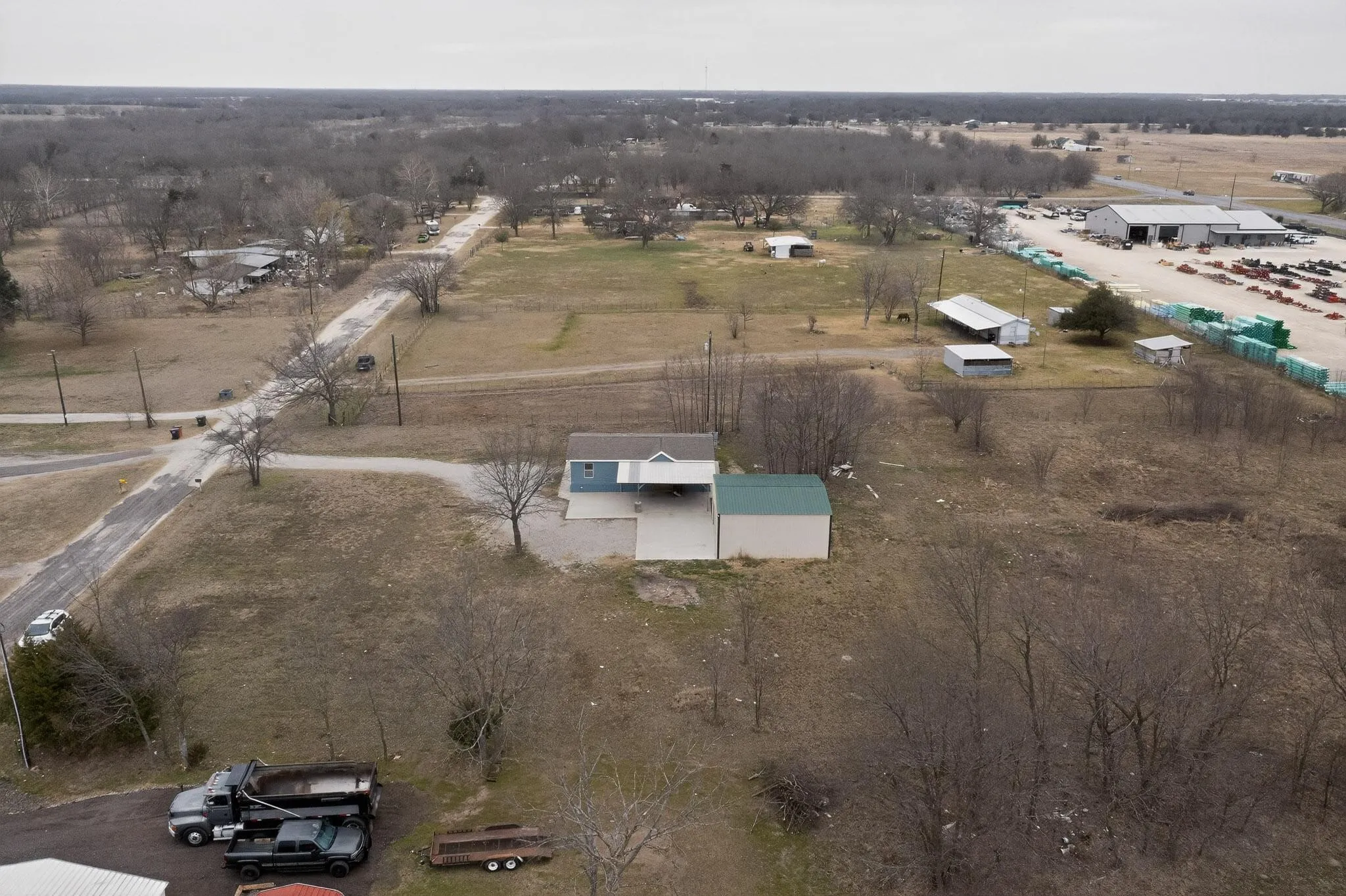 Aerial view of property and surrounding area with rural landscape