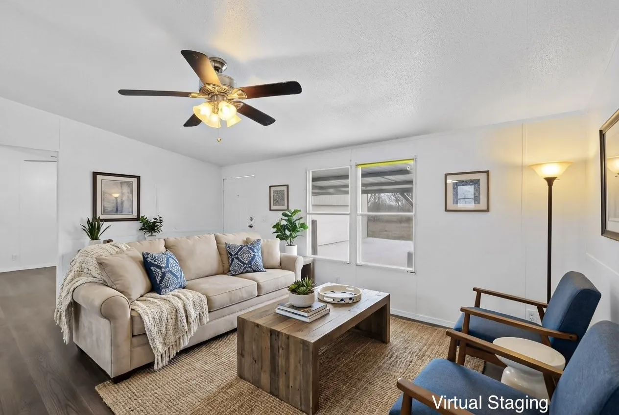 Living room with wood finished floors, ceiling fan, and a textured ceiling