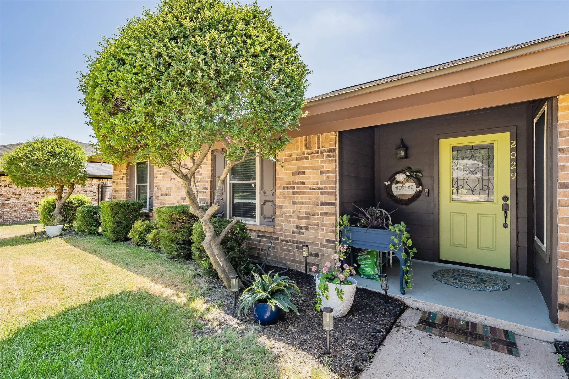 Brick exterior with a covered entry