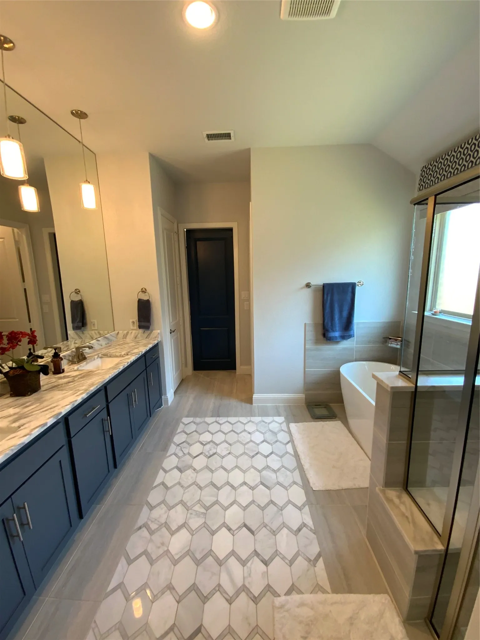 Different view of master bathroom