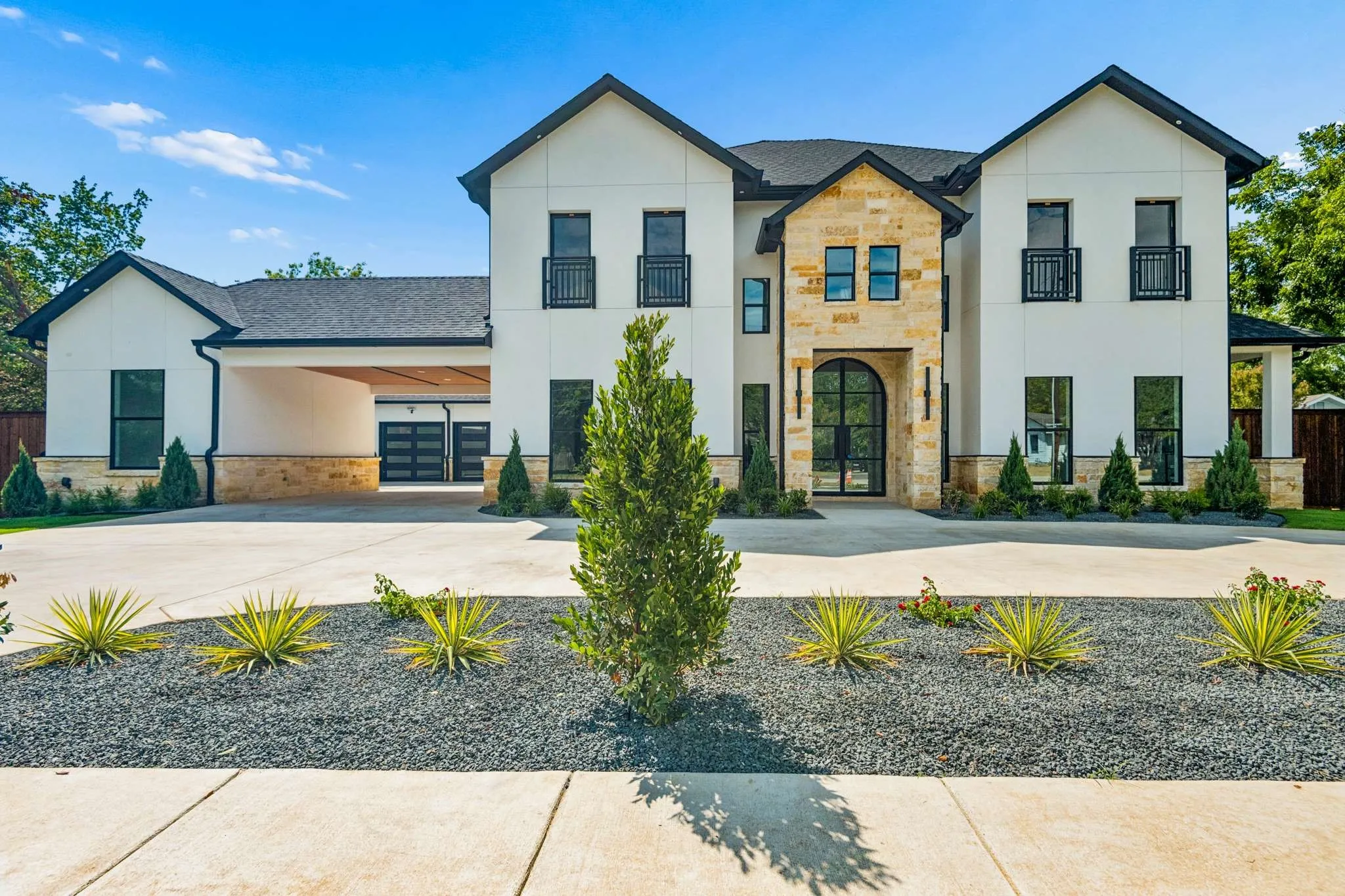 Contemporary exterior featuring stucco and stone accents