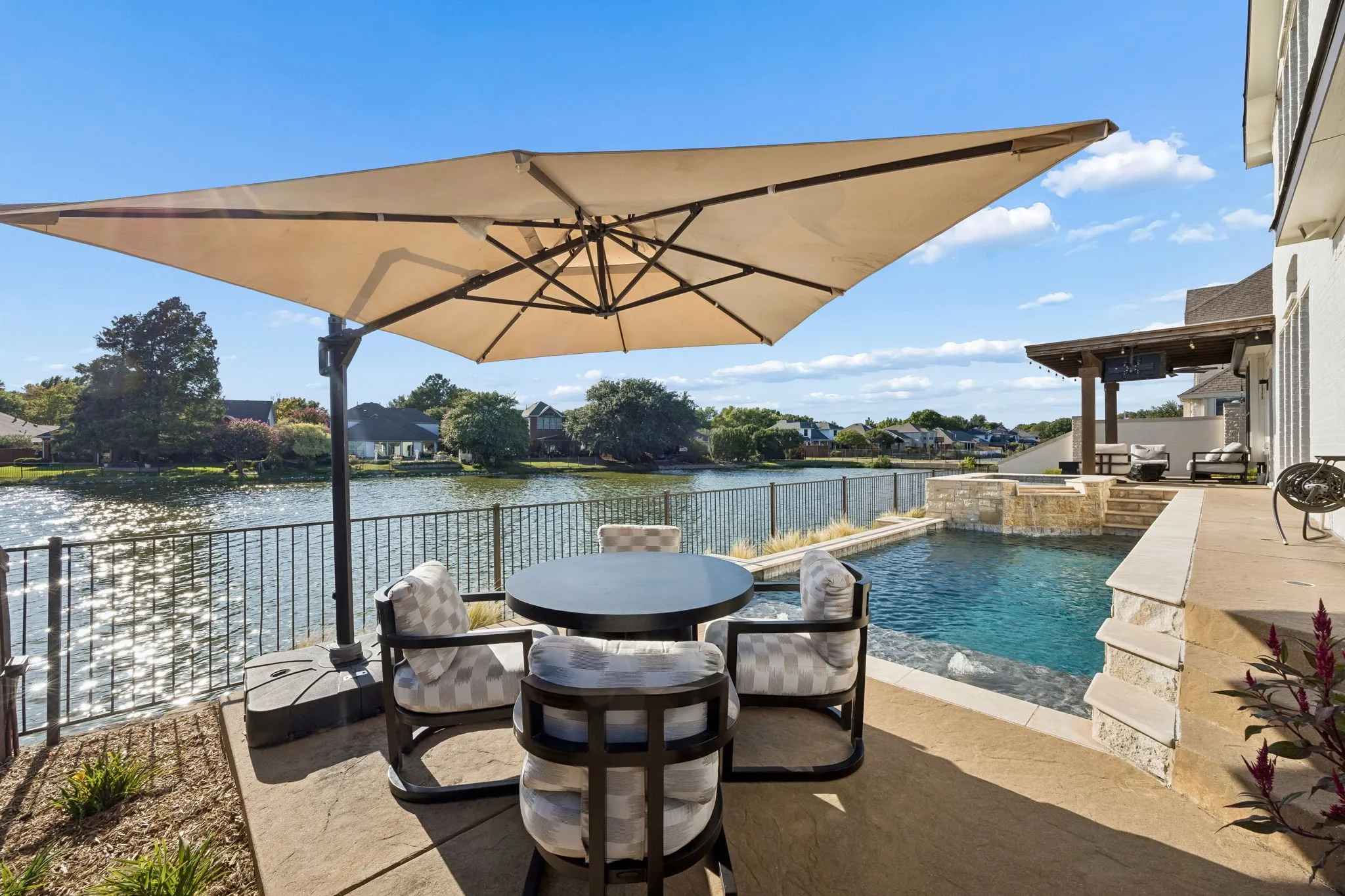 Outside, enjoy a private waterfront setting with a pool, spa and covered outdoor living area, complemented by expansive water views. The west-facing backyard provides a front-row seat to spectacular Texas sunsets, creating an exceptional backdrop for relaxing or entertaining.