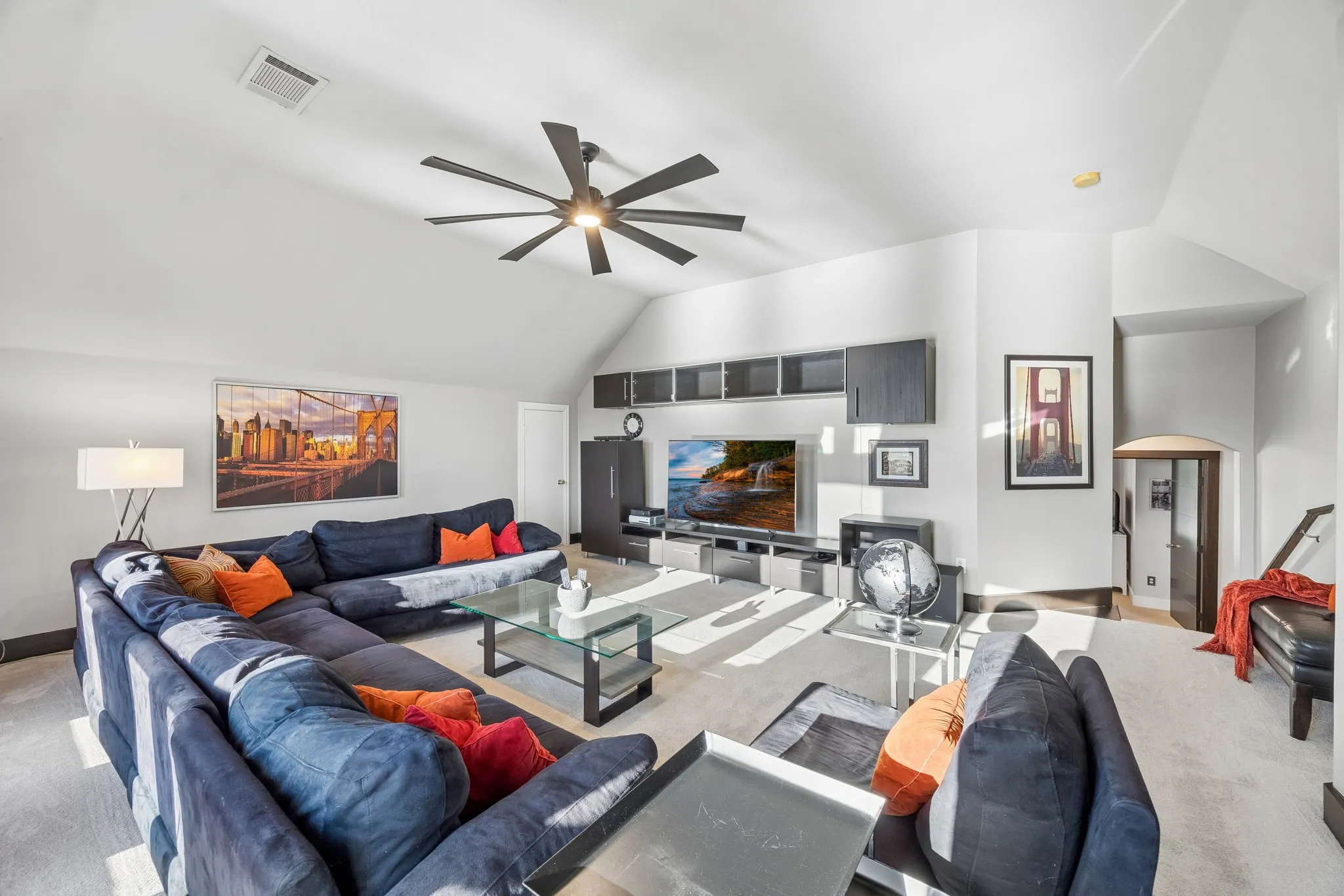 Spacious second living/game room with vaulted ceilings and abundant natural light is accompanied by two secondary bedrooms and a full bath, creating a flexible space for guests, family, movies or recreation.