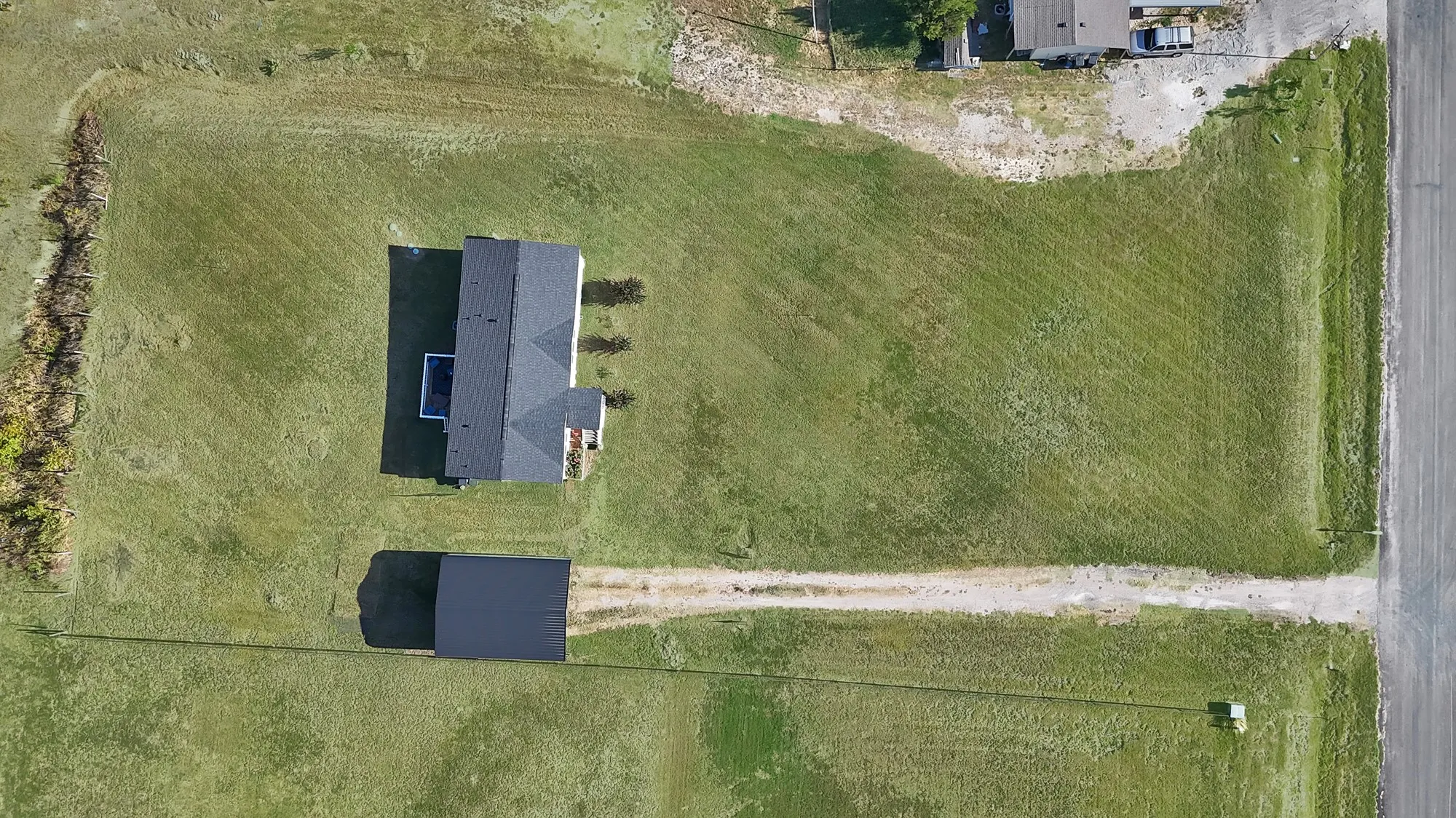 Expansive green lot with a detached structure