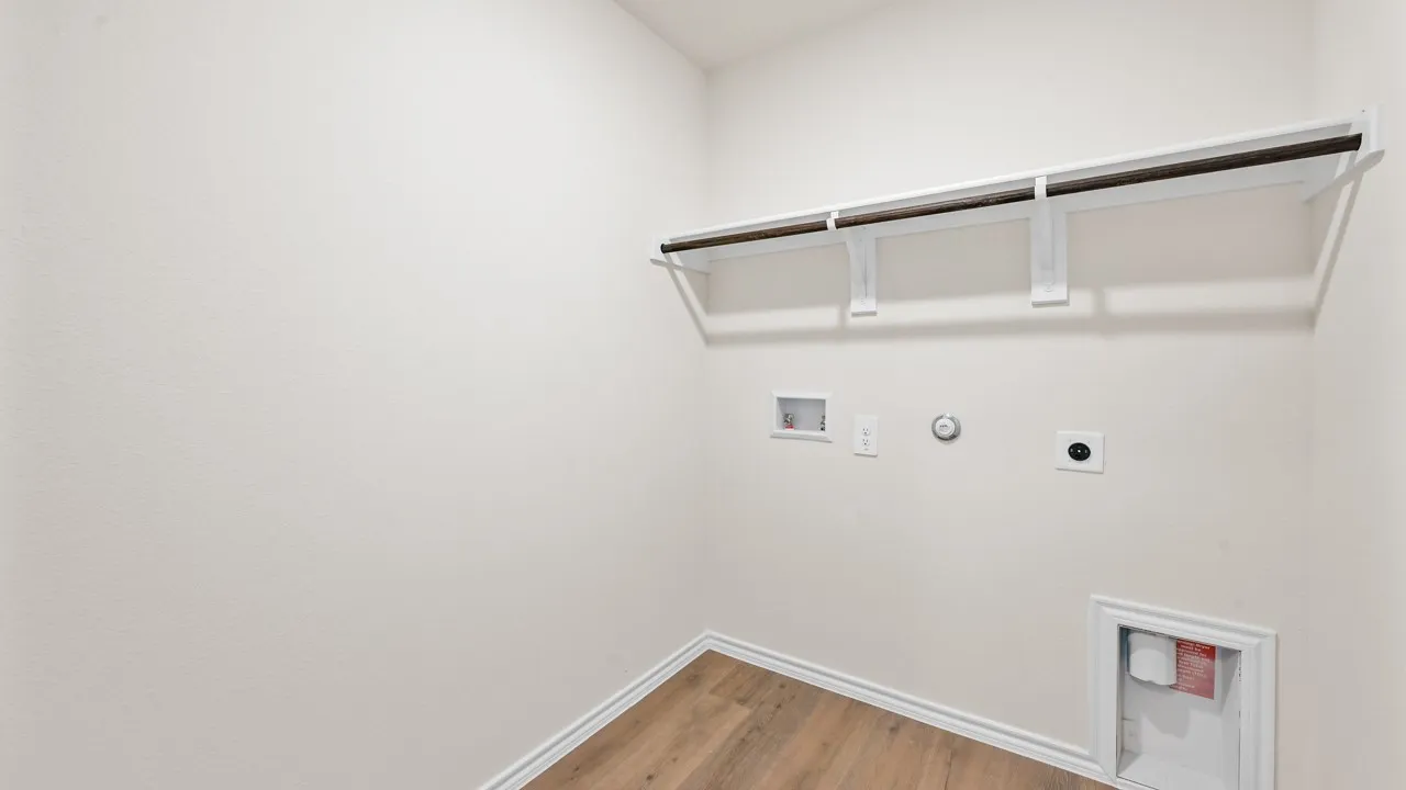 Wood-finish flooring, overhead shelving, and a hanging rod