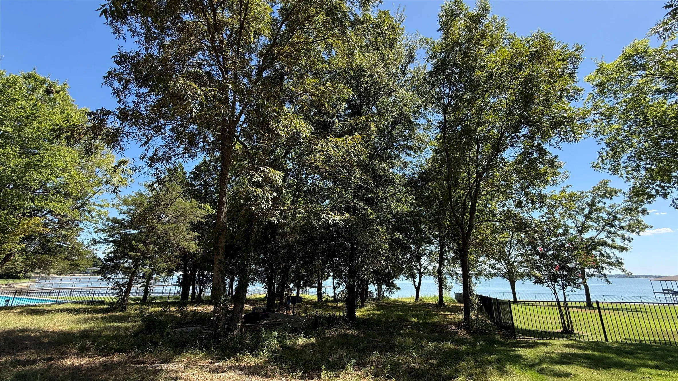 Mature shade trees add privacy and natural character to this Central Texas waterfront lot overlooking Richland Chambers Lake.