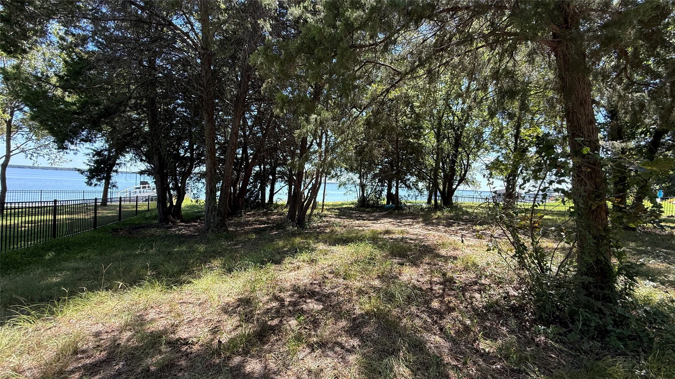 A canopy of trees and waterfront setting make this Navarro County property an inviting destination for weekend lake getaways.