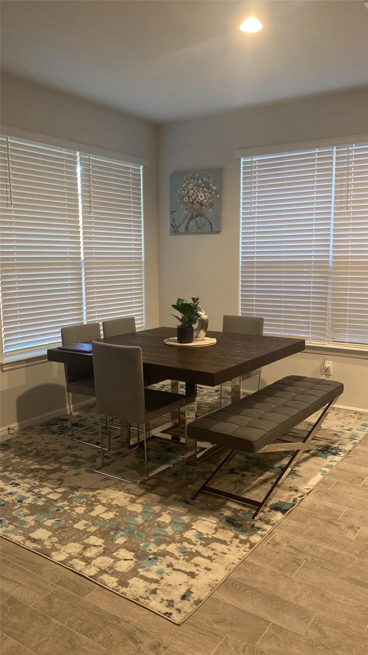 Dining space featuring wood finished floors and recessed lighting