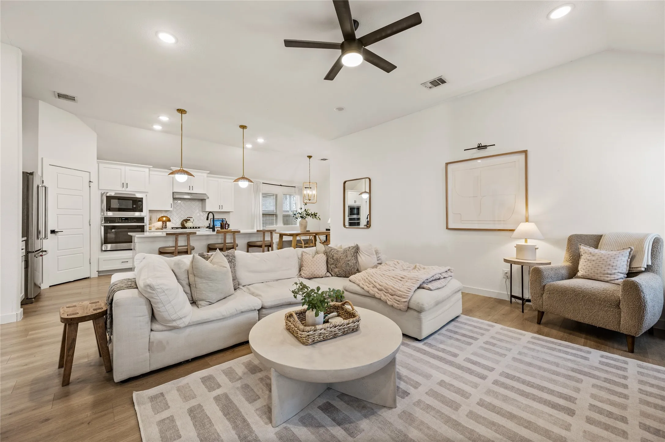 Ceiling fan. Open living. LVP. Neutral paint.
