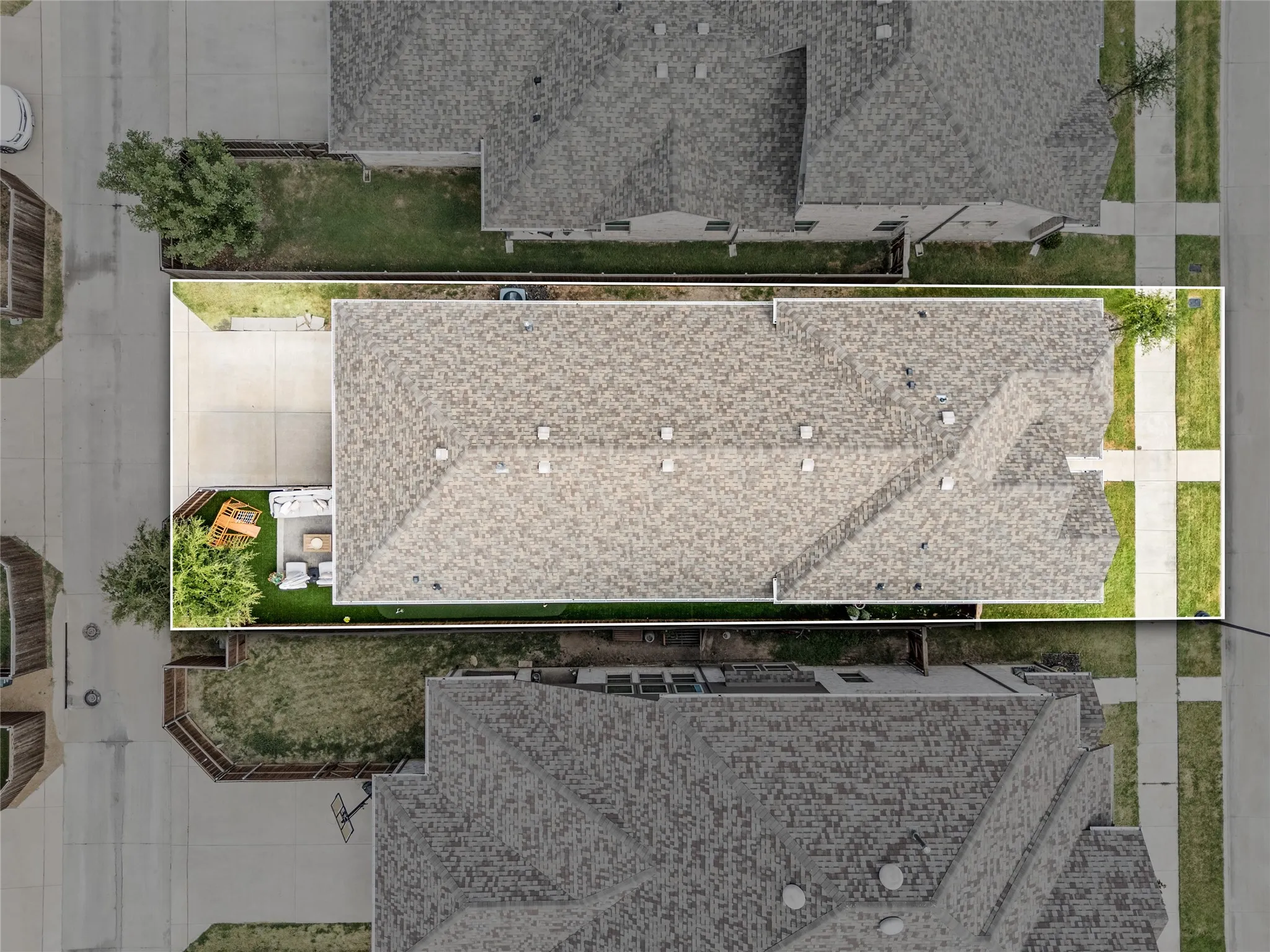 Driveway and garage at rear.