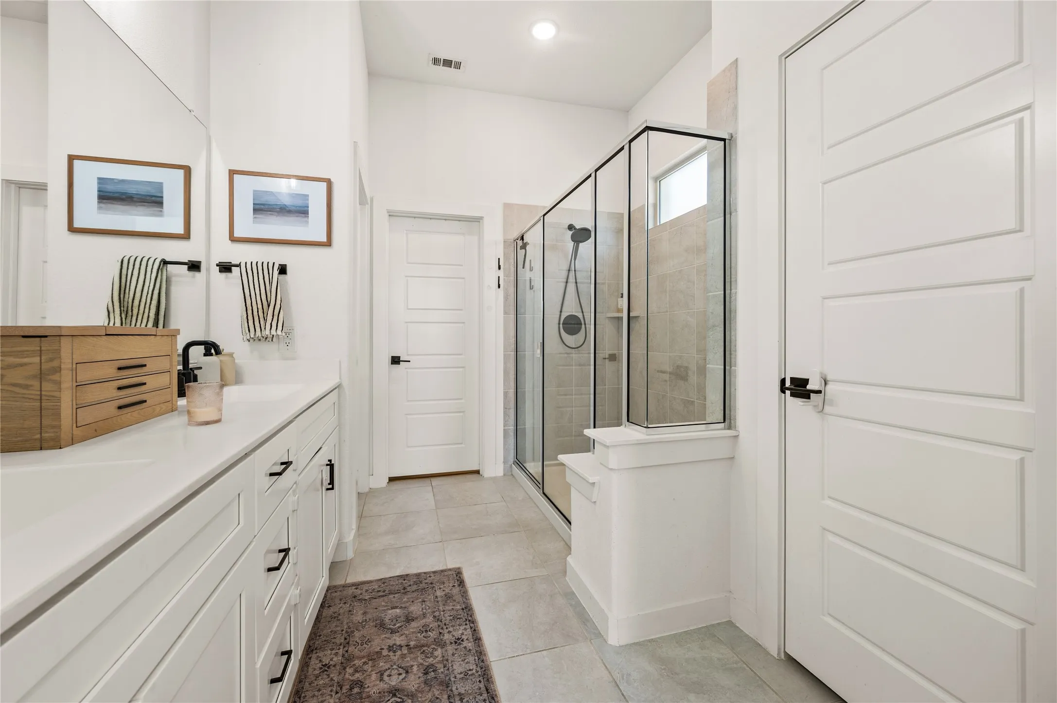 Extended shower. Closet entry. His and hers dual sinks.