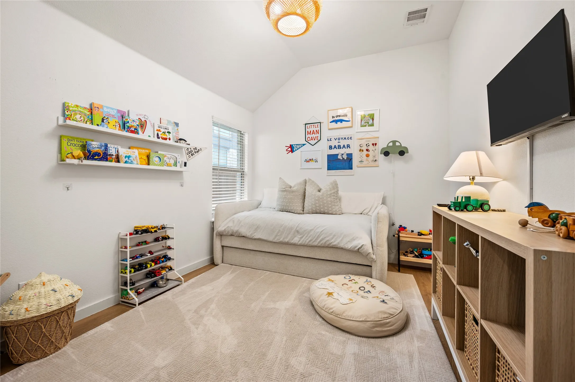 Secondary with LVP flooring, light fixture, closet.