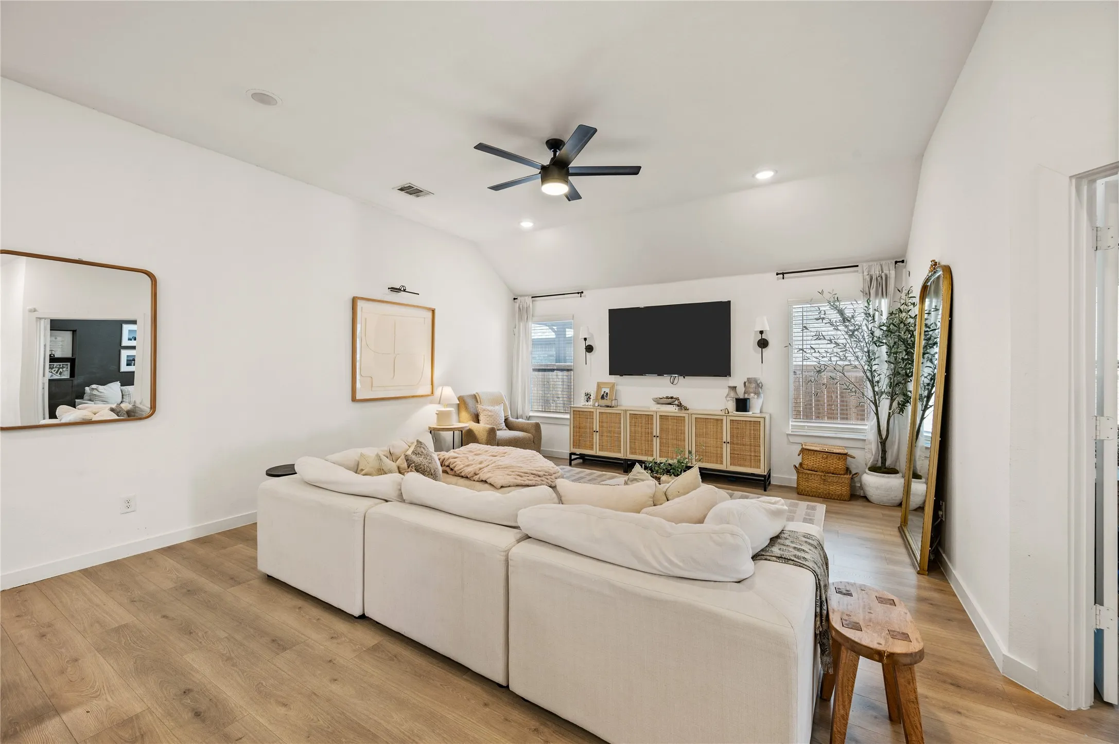 Ceiling fan. Open living. LVP. Neutral paint.