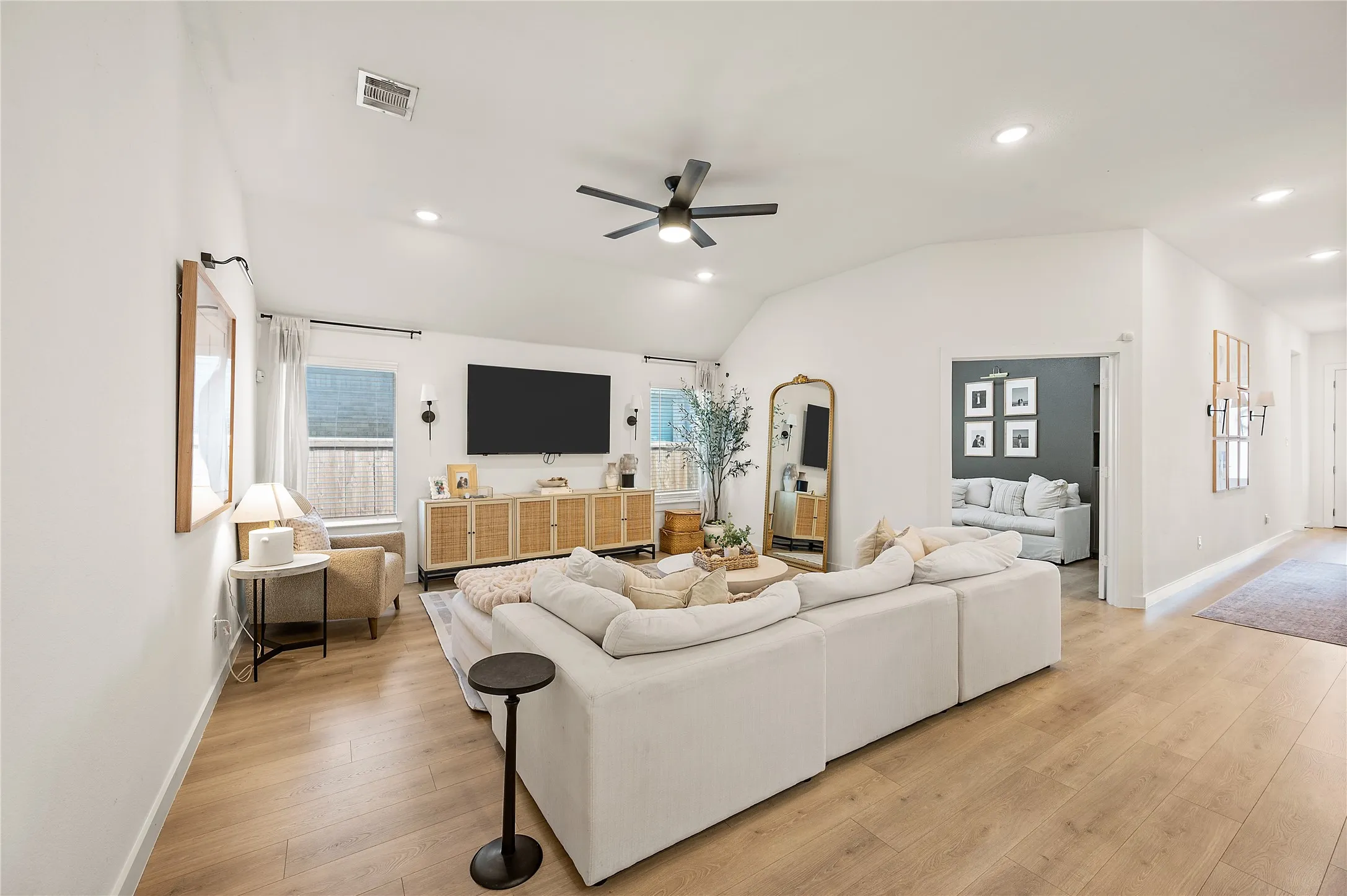 Ceiling fan. Open living. LVP. Neutral paint.