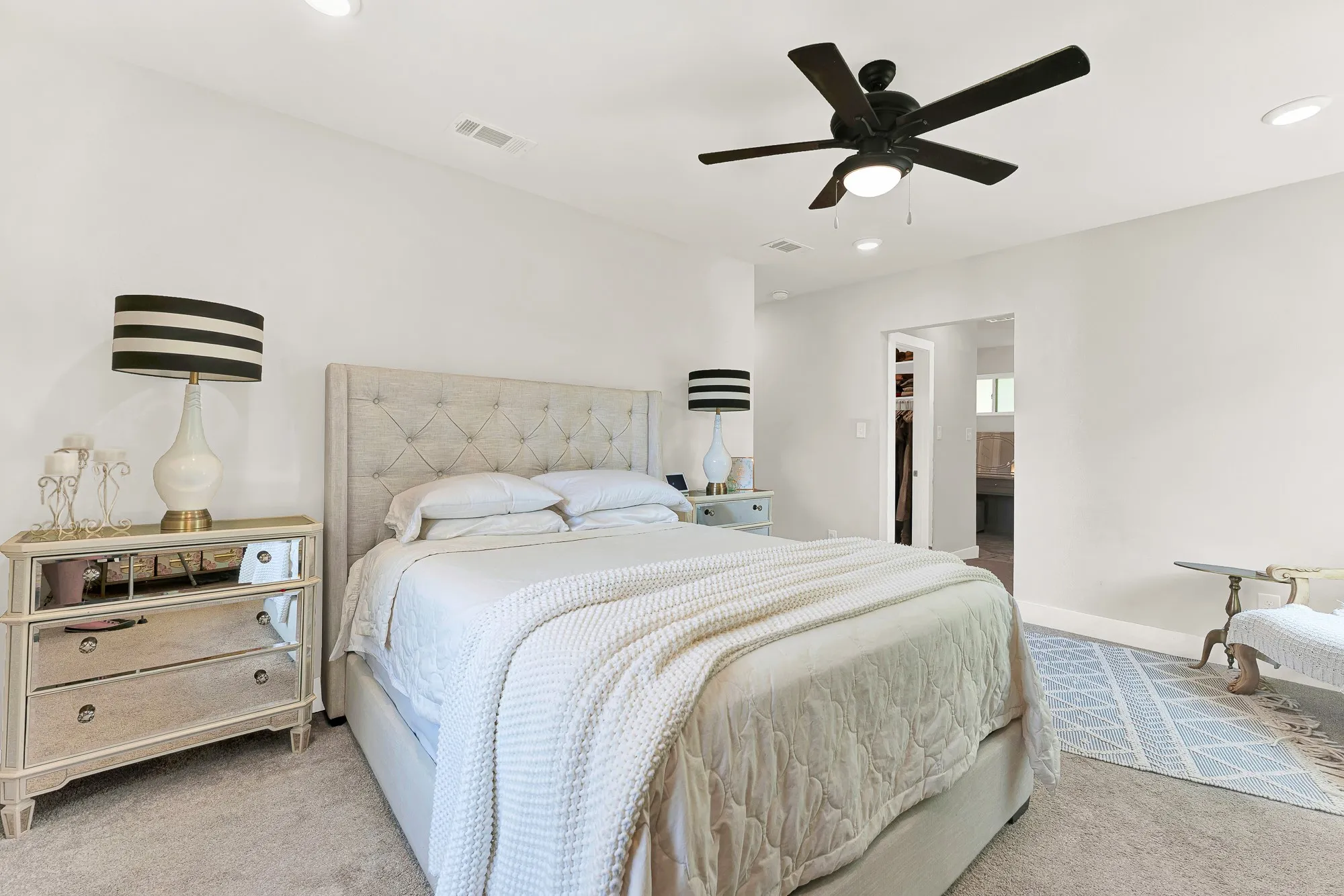 Recessed lighting, ceiling fan with integrated light, light-toned wall color, carpeted flooring, and a wide entryway