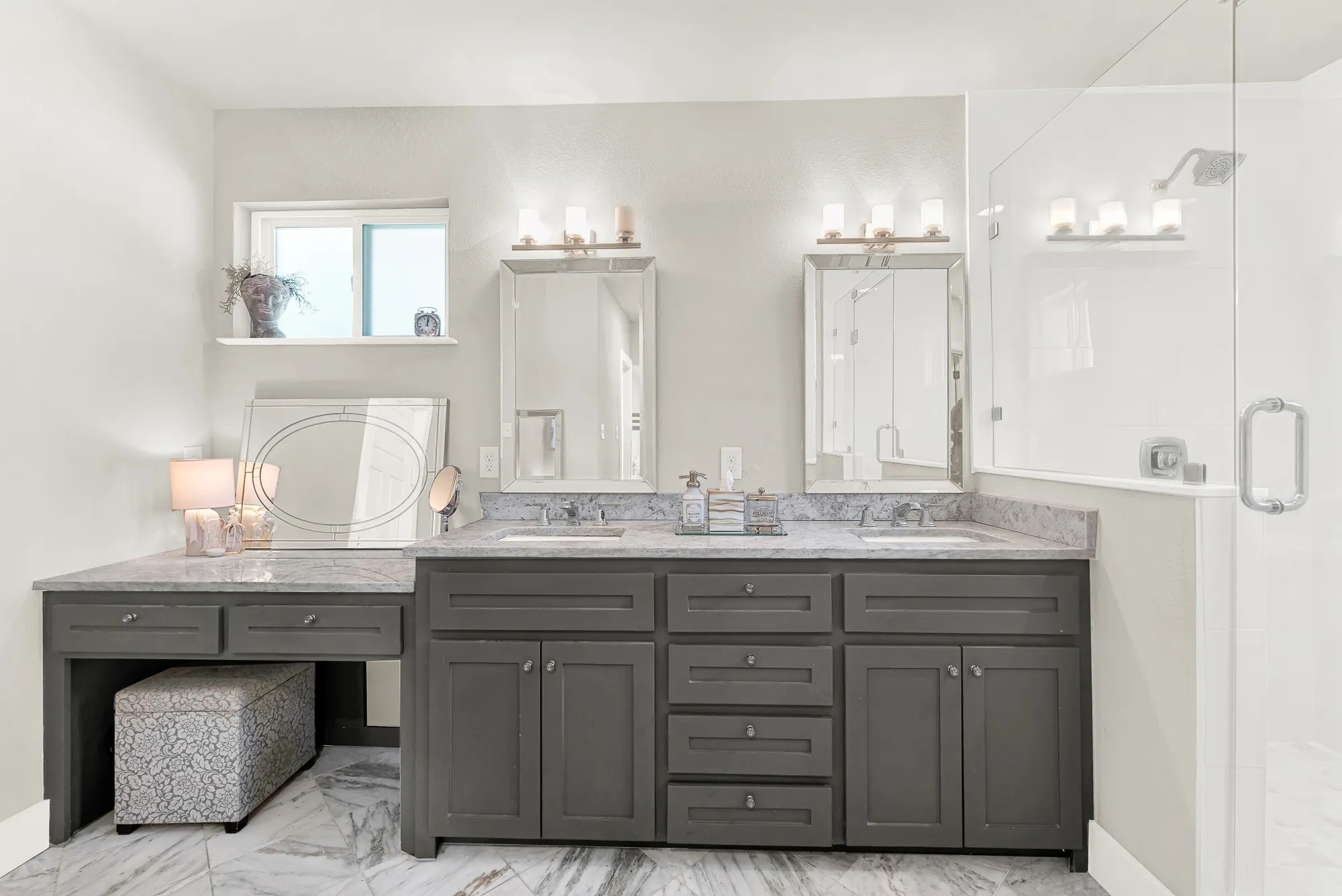 Dual vanity with undermount sinks, stone countertops, and dark wood-finish cabinetry