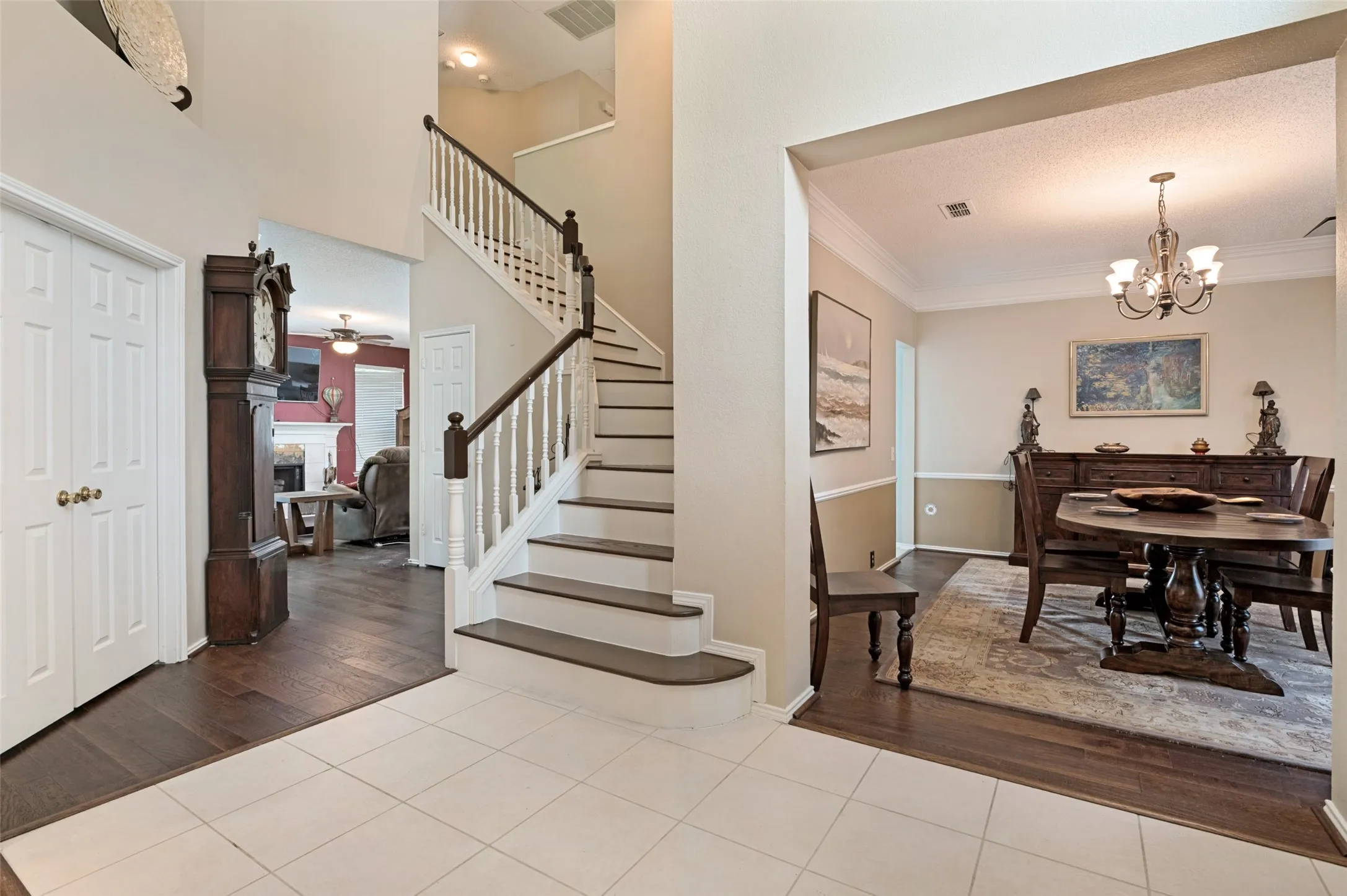 Tiled Entryway with access to the Formal Dining and Hardwood stepped Staircase