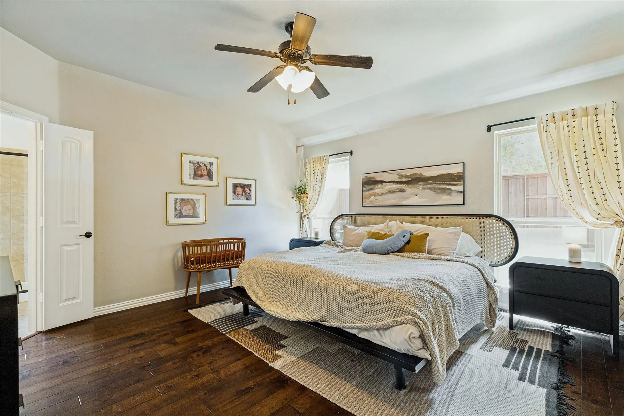 Rich wood-finish flooring, recessed lighting, and a ceiling fan with light fixture