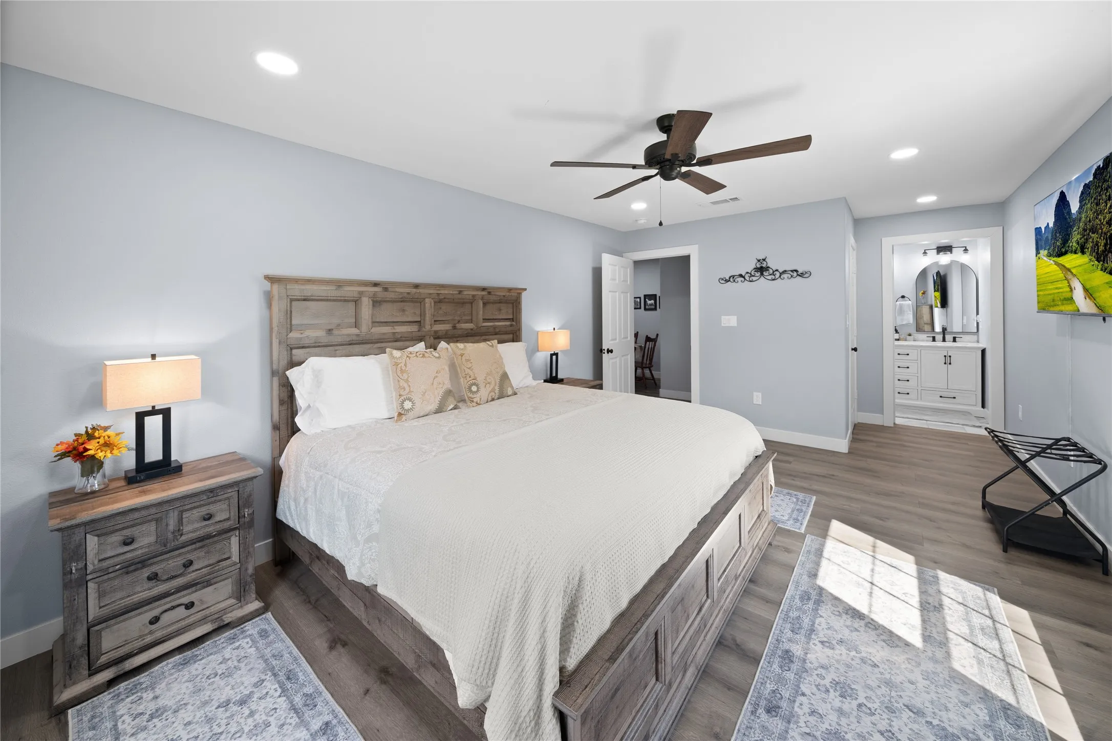Wood-finish flooring, recessed lighting, and a ceiling fan