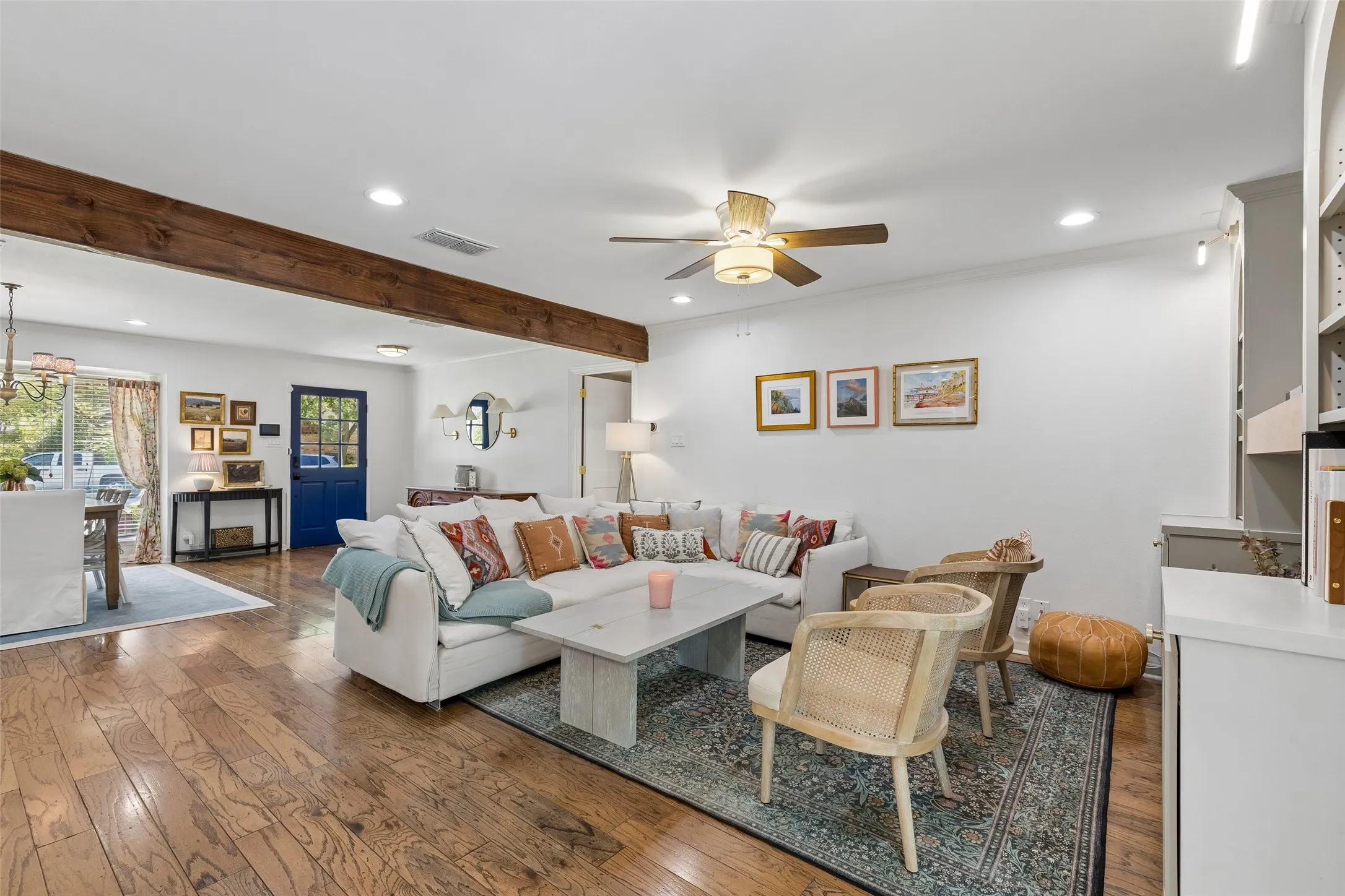 Living room with hardwood floors and ample seating.