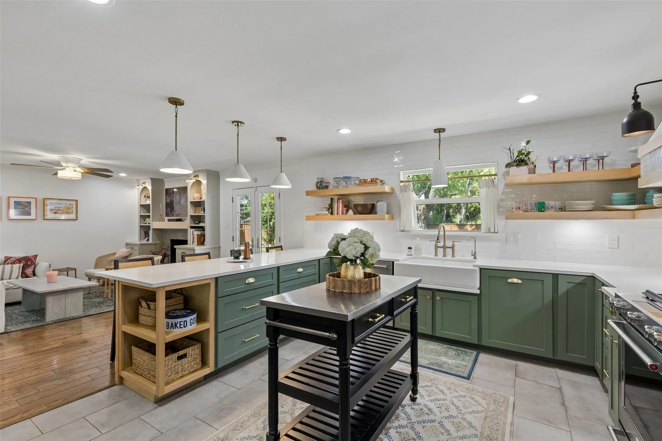 Statement lighting, farm sink and stainless steal appliances