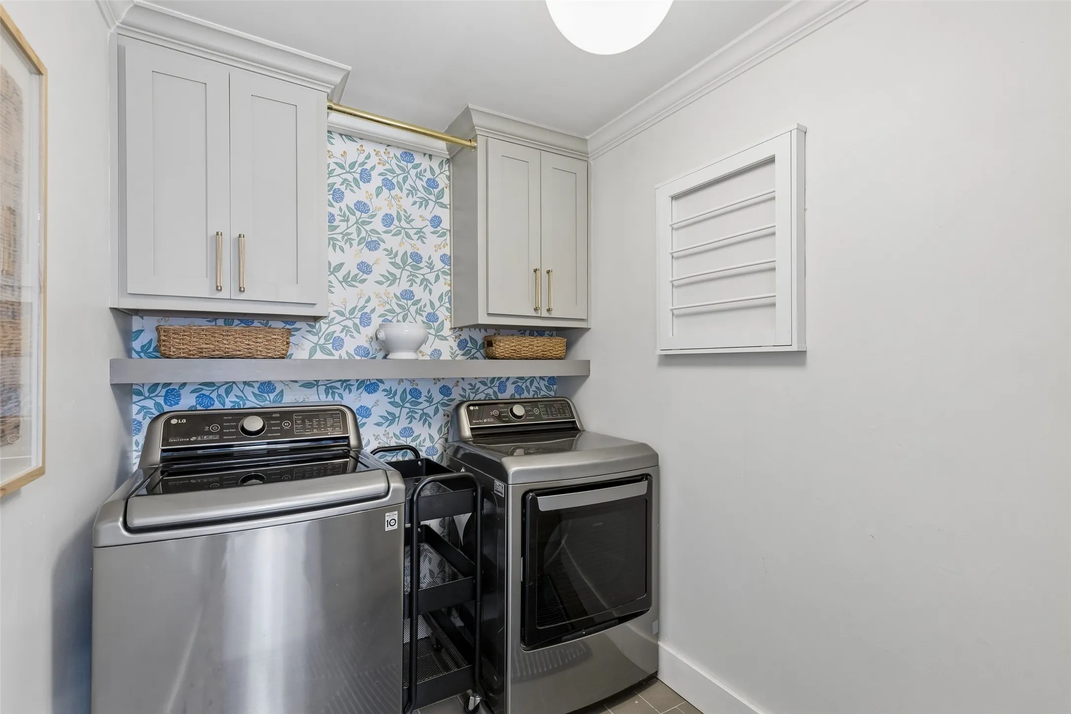 Laundry room with full size capacity and drip dry area.