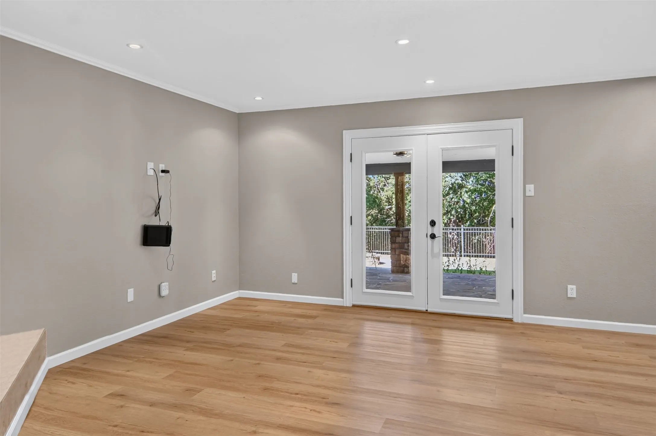 Living area has two sets of double doors leading to the unbelievable backyard