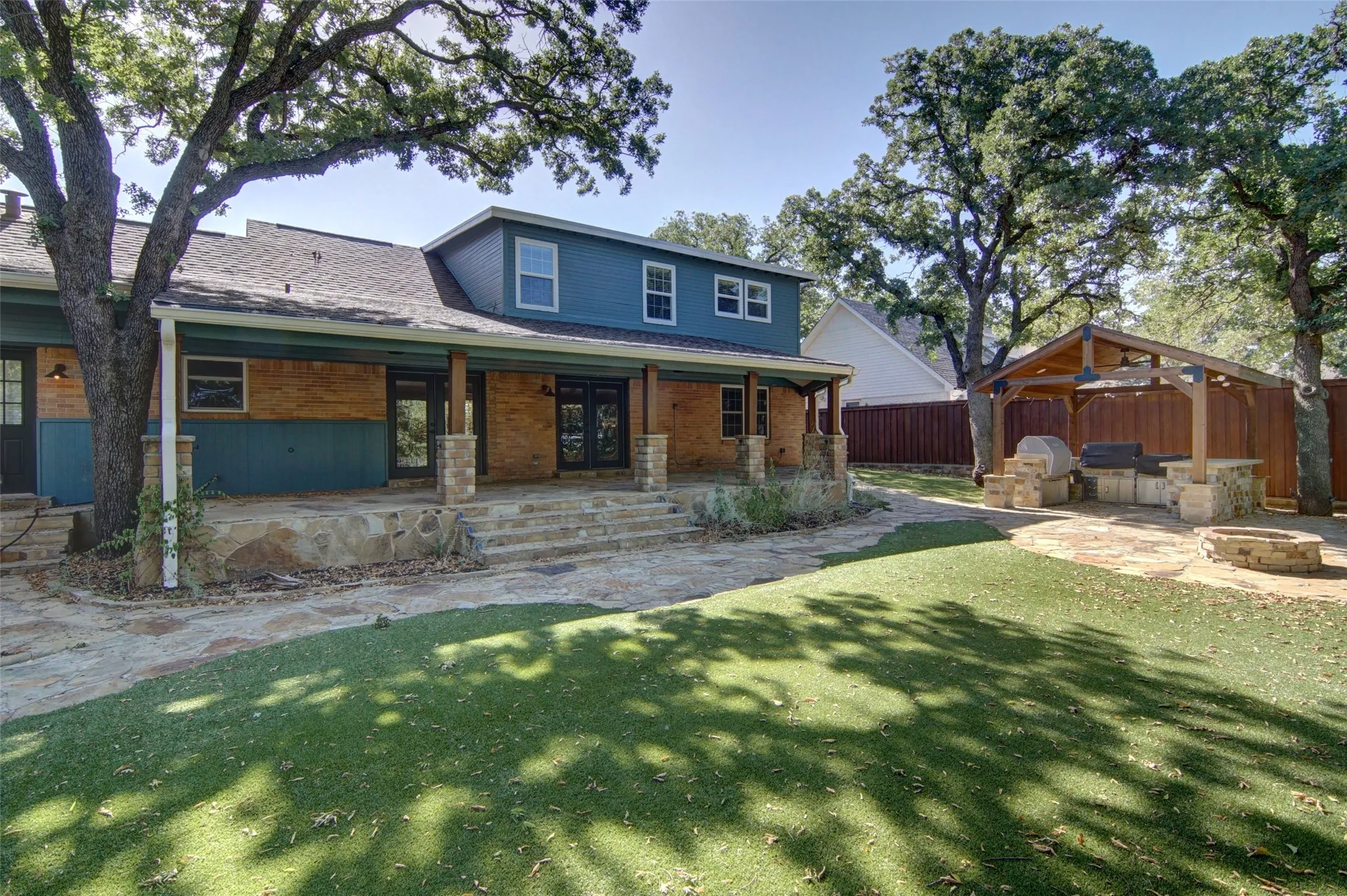 Amazing back porch, unbelievable stonework, and a Dream outdoor kitchen
